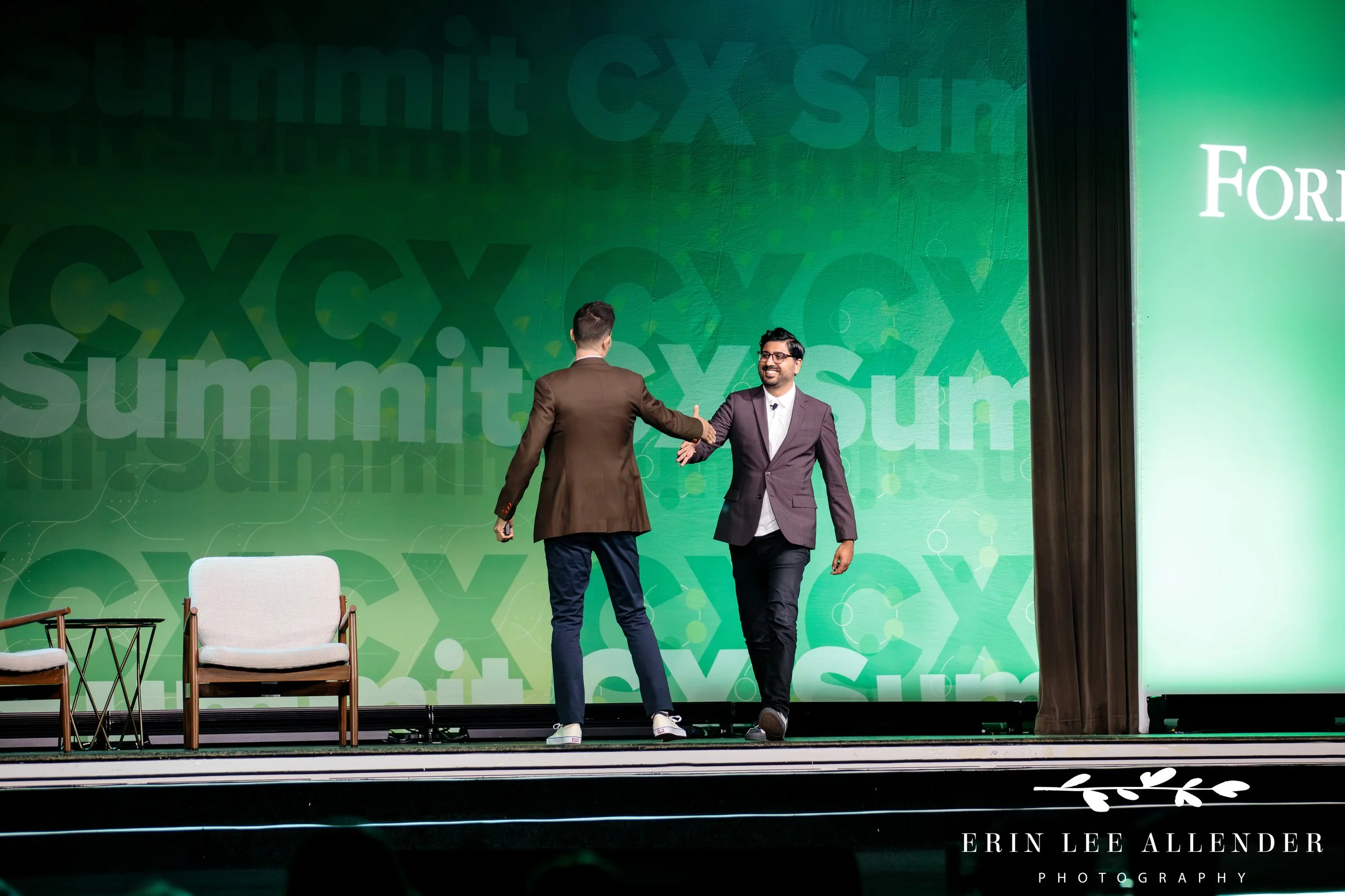 keynote speaker shaking hands with guest speaker during conference at opryland hotel