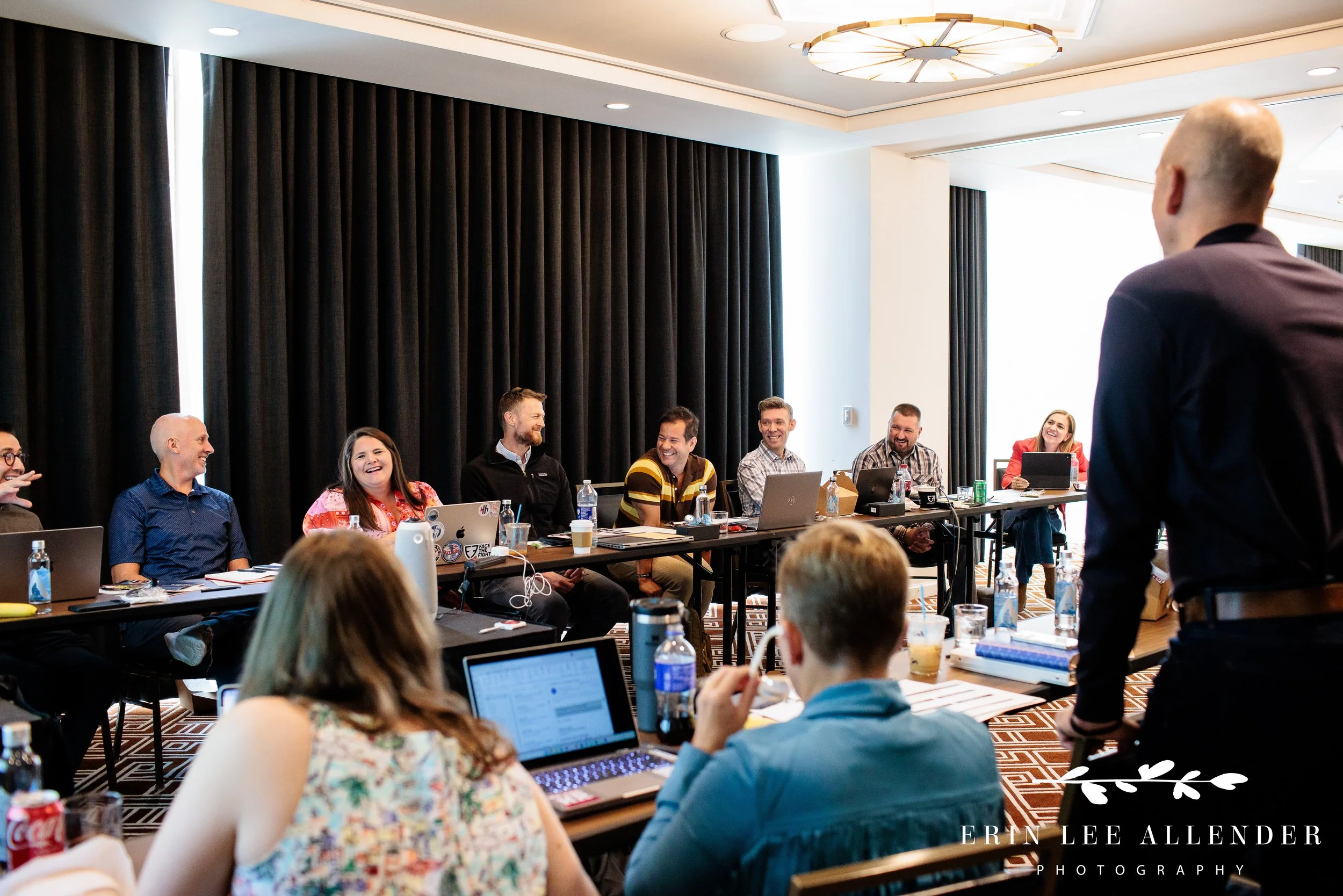 Candid moment of laughter between Face the Fight board members at the Thompson Hotel, Nashville