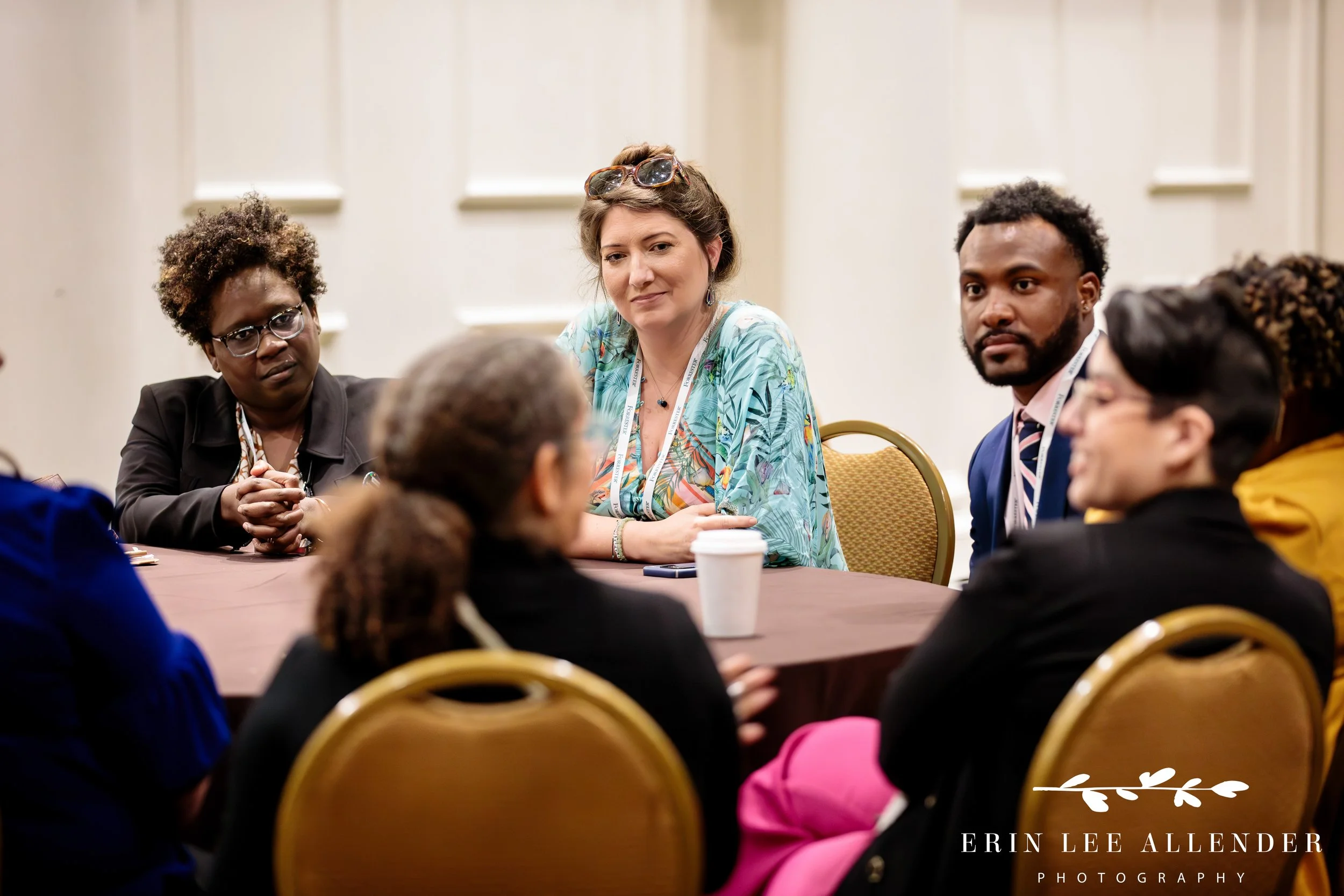 Nashville conference photography — attendees seated at tables in discussion during a Forrester CX Conference breakout session at Gaylord Opryland Hotel