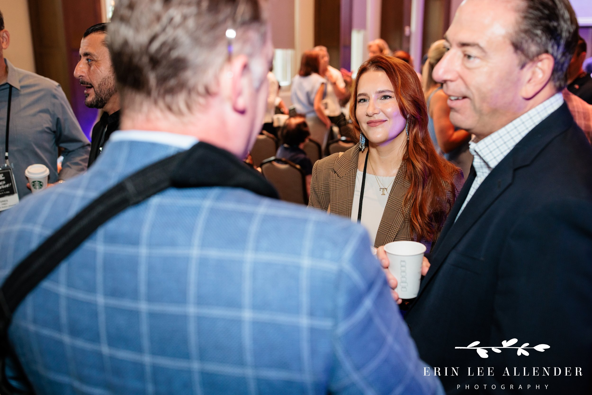 Nashville corporate event photography — attendees talking at Face the Fight's Louder Together morning program at Ole Red