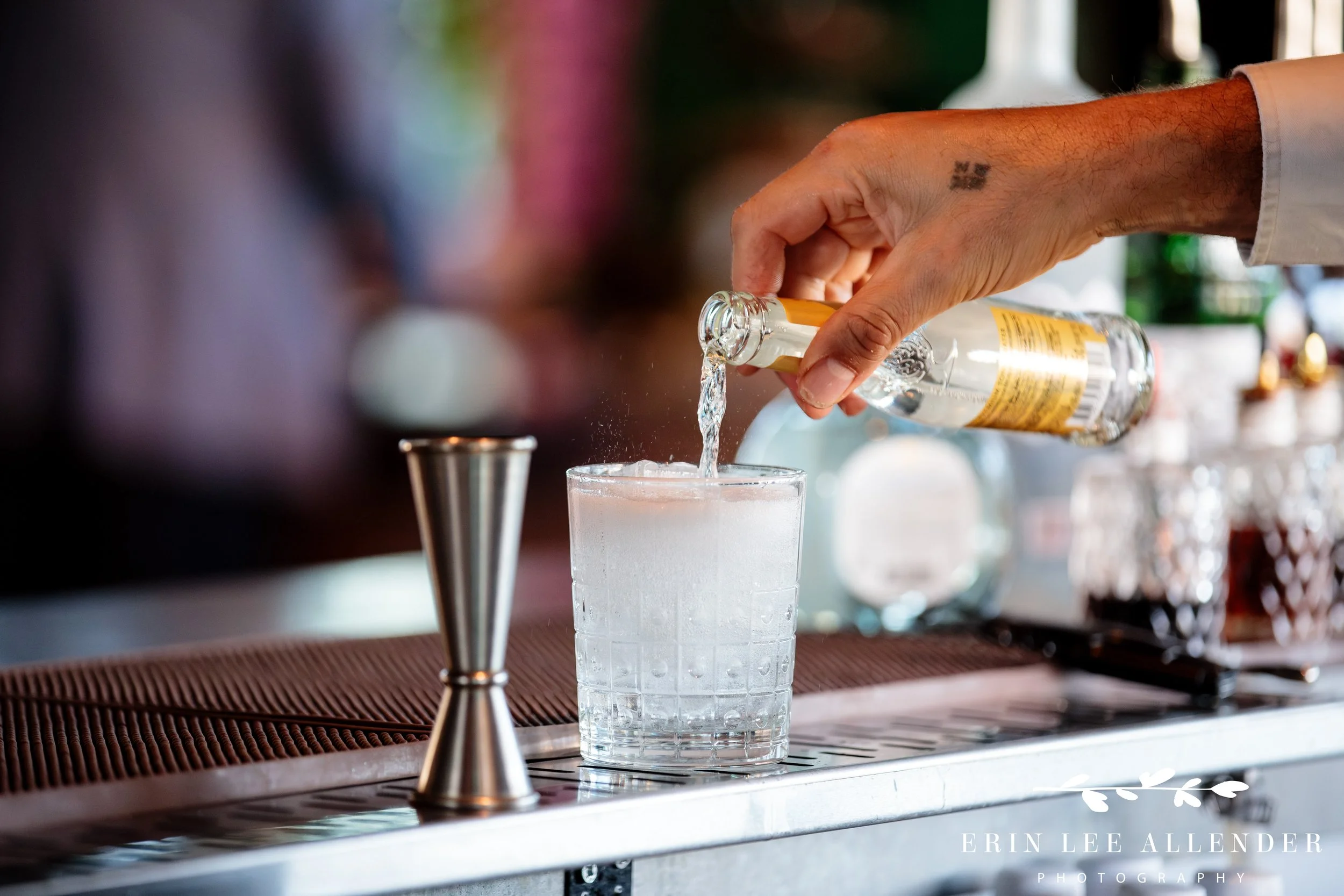 Nashville corporate event photography — drink being poured at Thistle and Rye during CBIZ Nashville Summit welcome reception