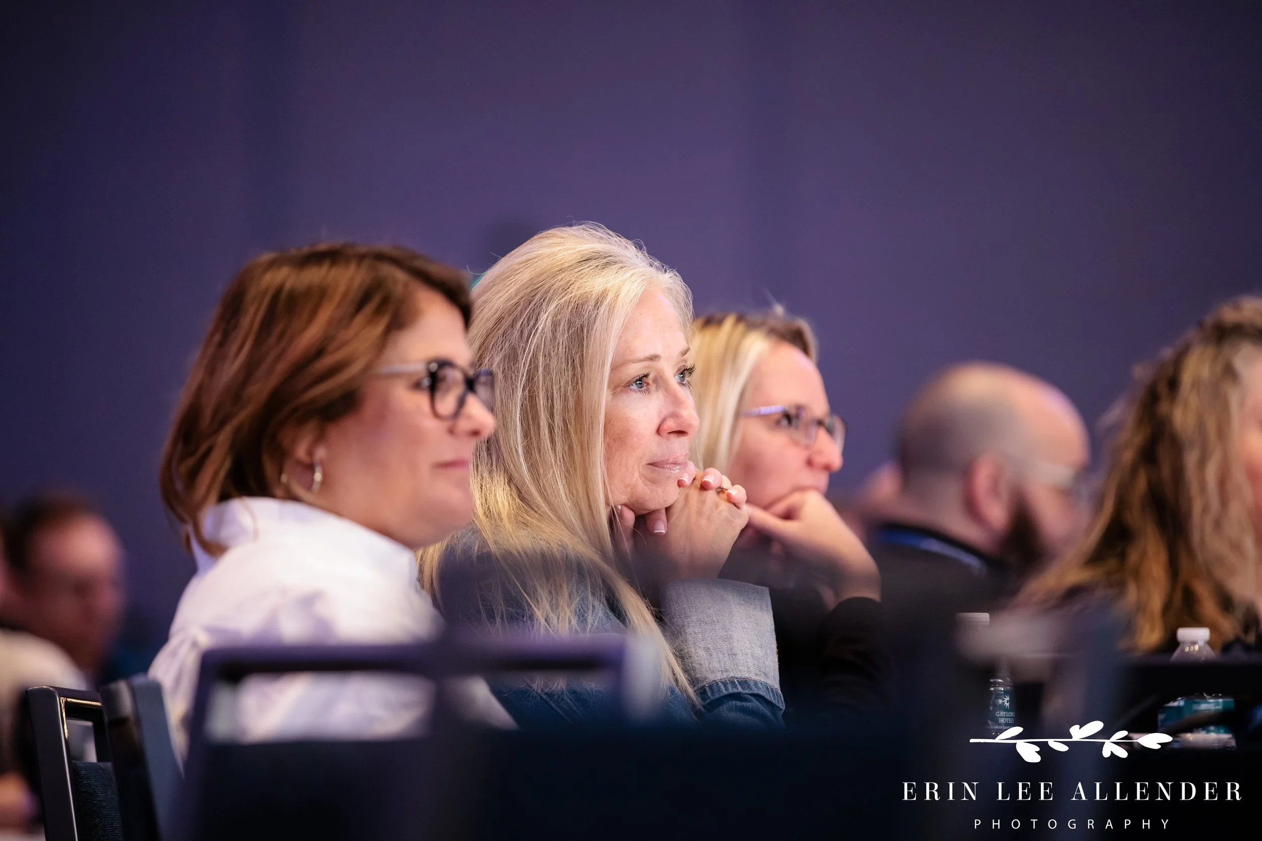 Nashville conference photographer capturing attendees deeply engaged during a keynote session at RubinBrown's conference at Gaylord Opryland Resort