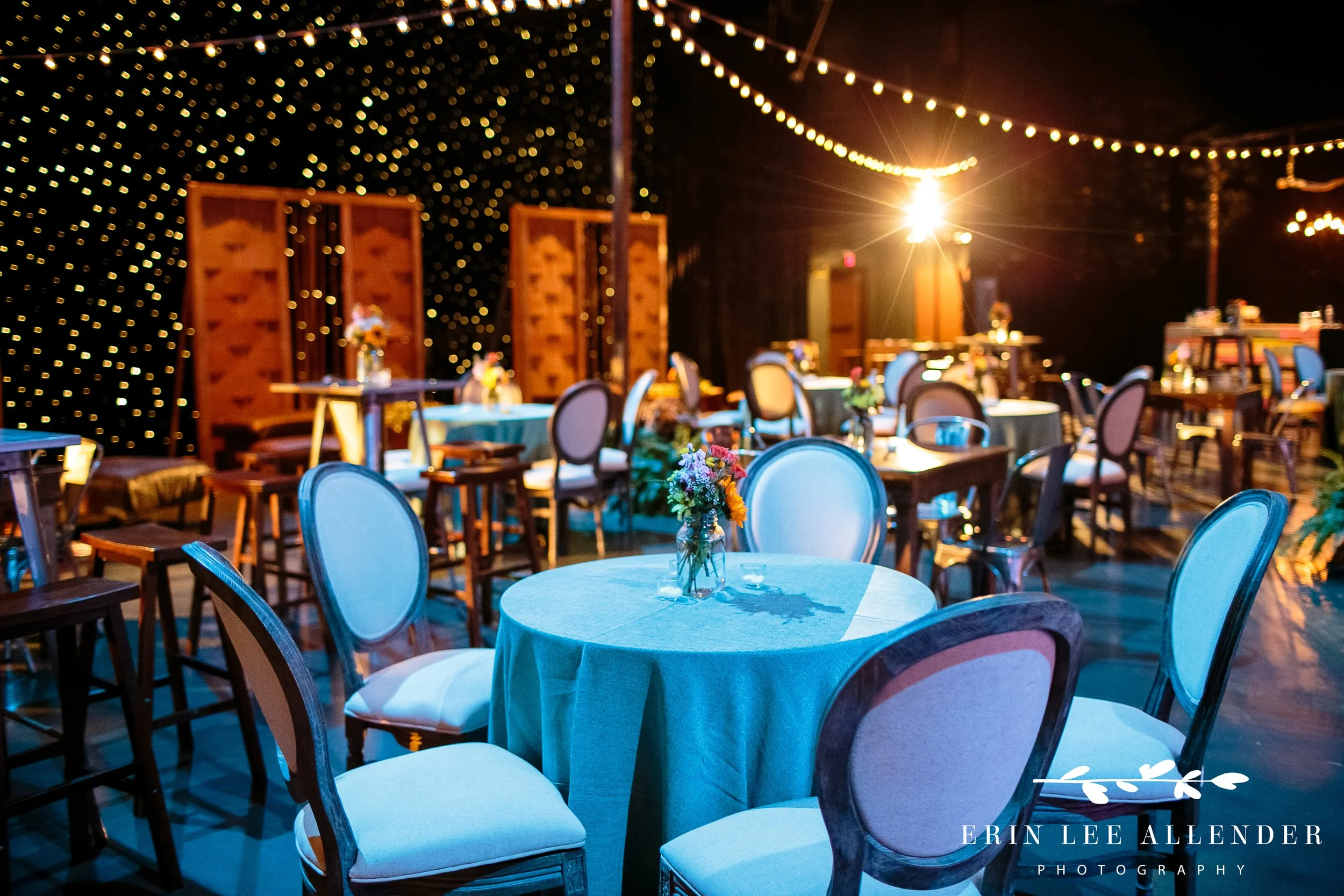 Café lights and rustic fencing at Grand Ole Opry corporate dinner setup Nashville