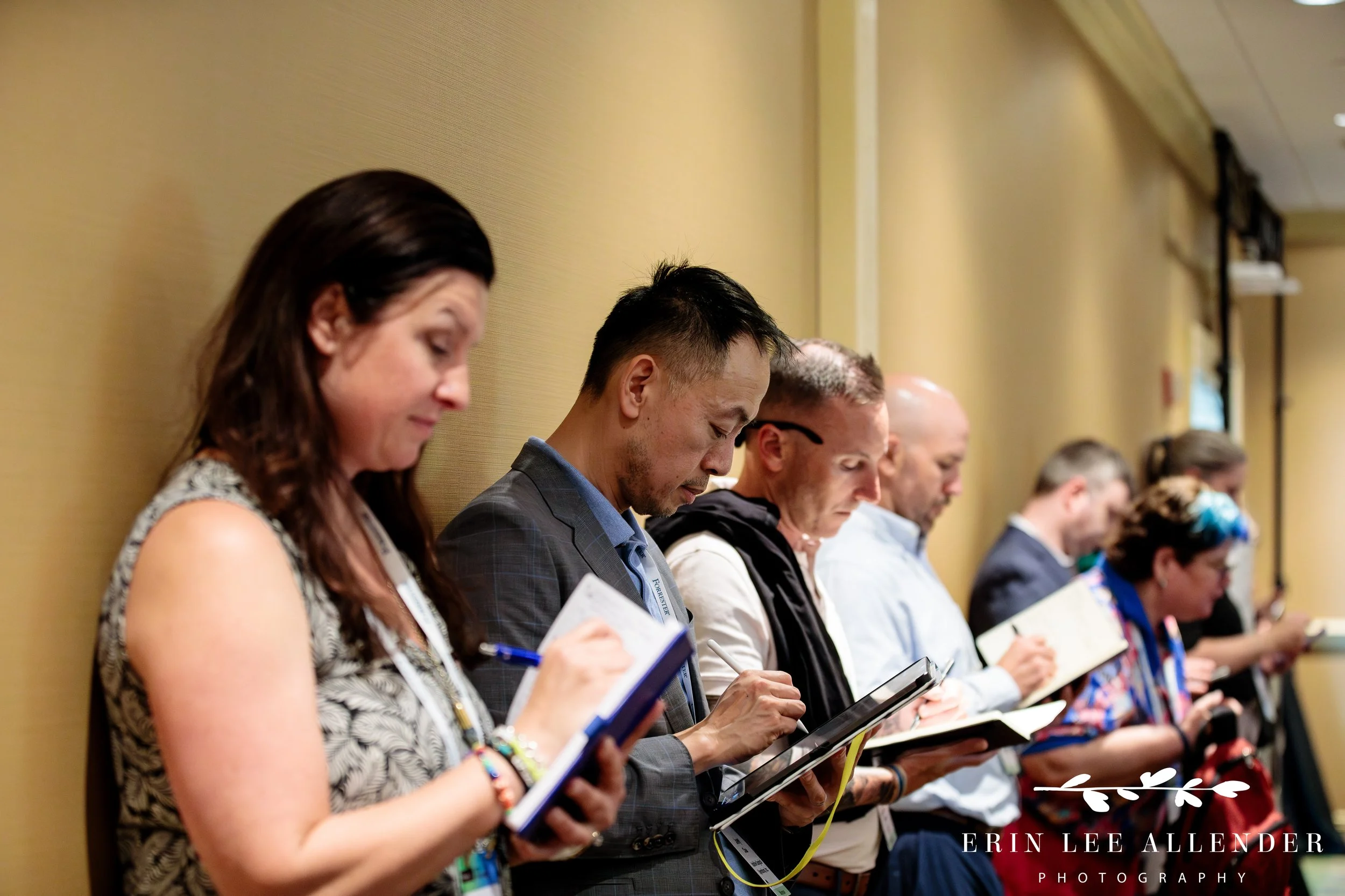 Nashville event photographer — attendee taking notes at a table during a Forrester CX Conference breakout session at Gaylord Opryland Hotel