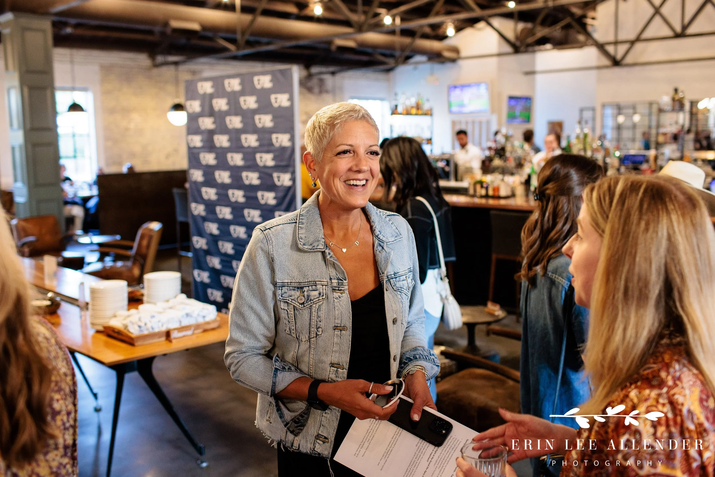Guests mingling near the bar area at Face the Fight welcome party, Pinewood Social Nashville