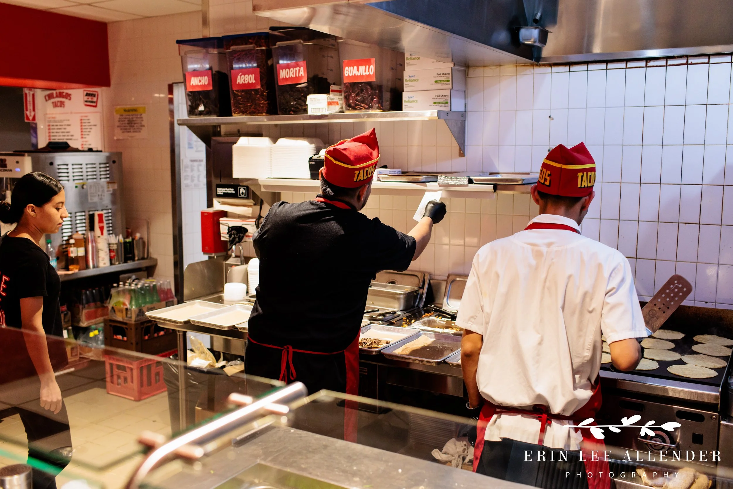 Chefs preparing tacos for guests at Assembly Food Hall during a corporate event