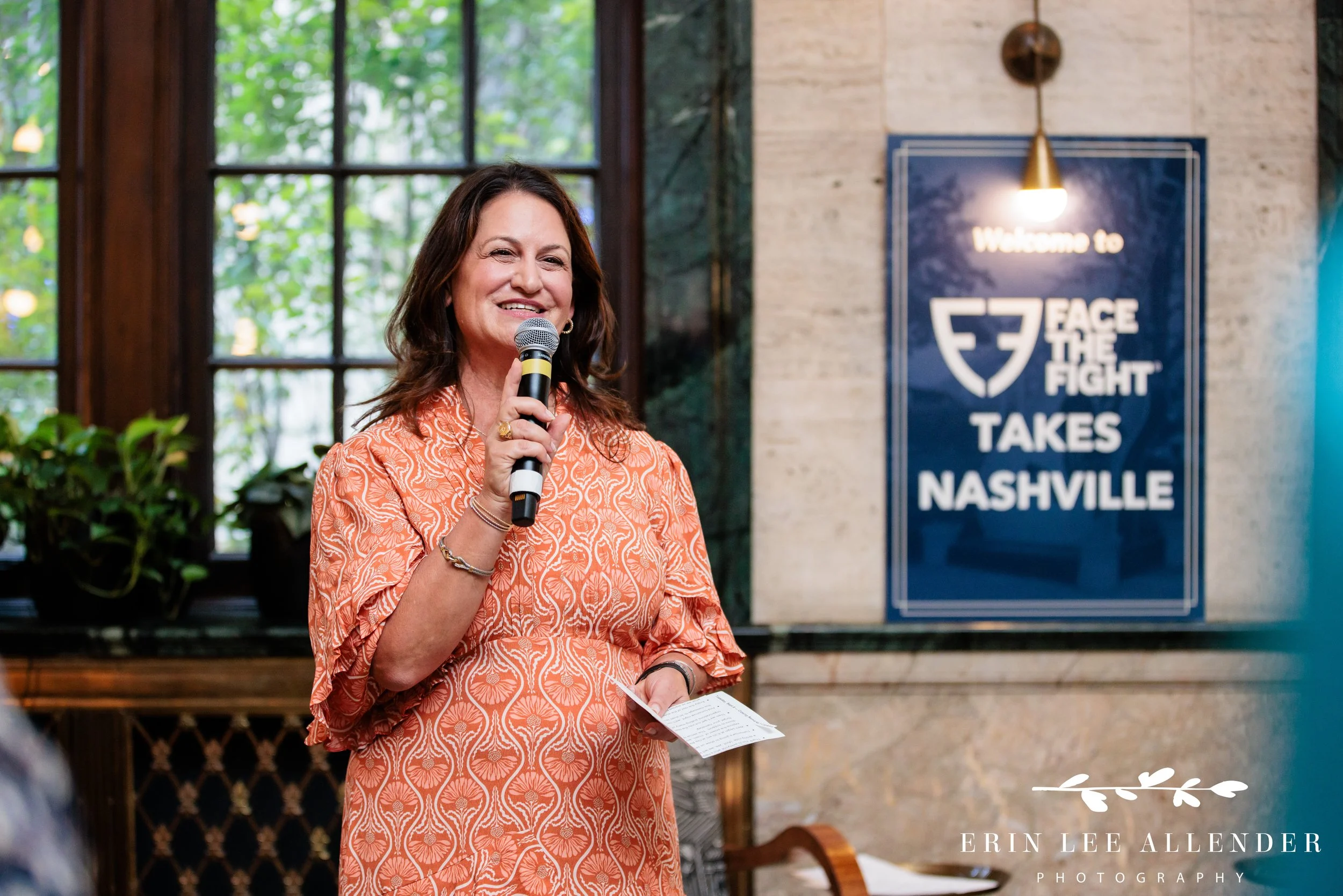 Nashville nonprofit event photography — Babs Chase, executive director of the Elizabeth Dole Foundation, speaking at Face the Fight's opening night at Noelle