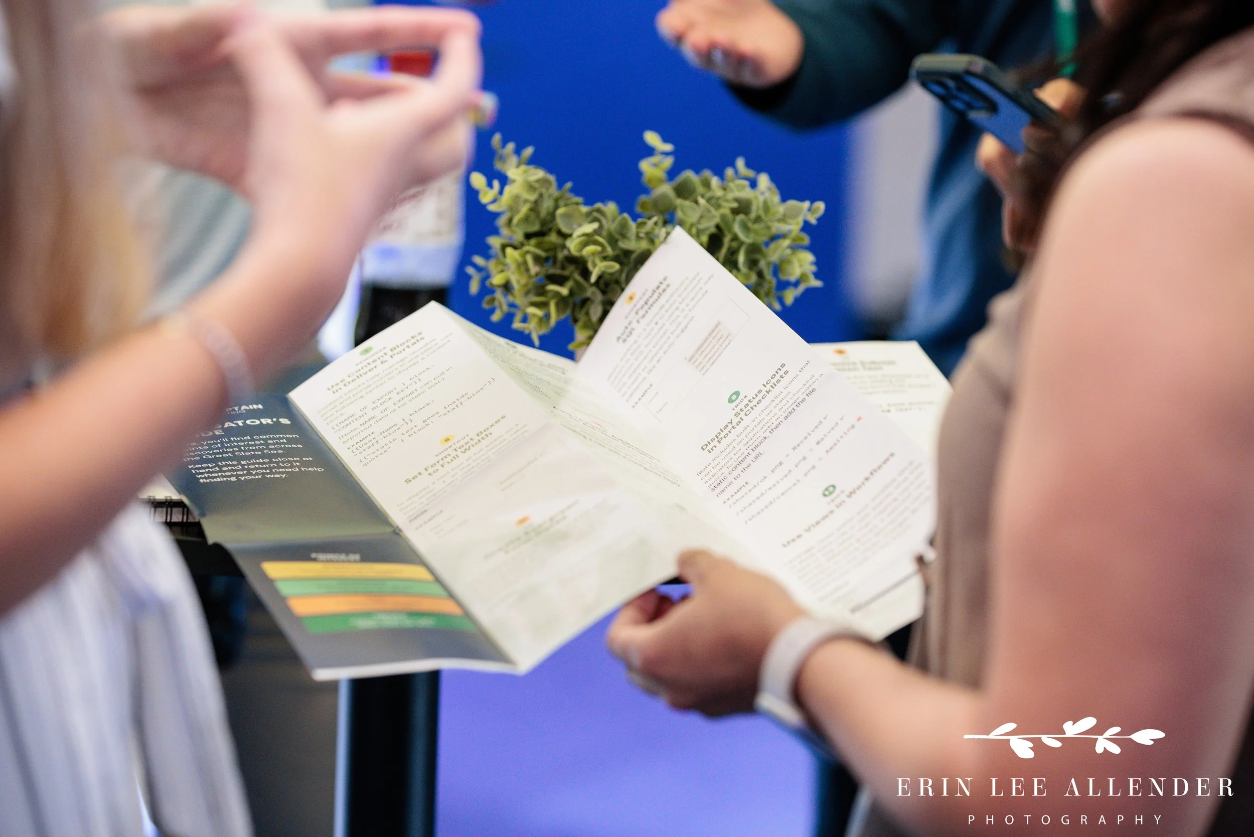 Nashville conference photography — close-up of hands holding the Slate cheat-sheet nautical map at Post Captain's Slate Summit booth, Music City Center