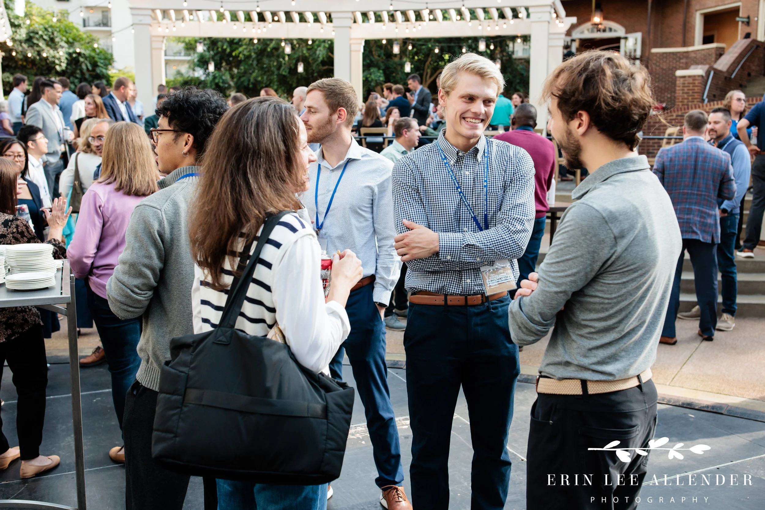 Delta Island Opryland cocktail party photography of guests in conversation during a RubinBrown reception