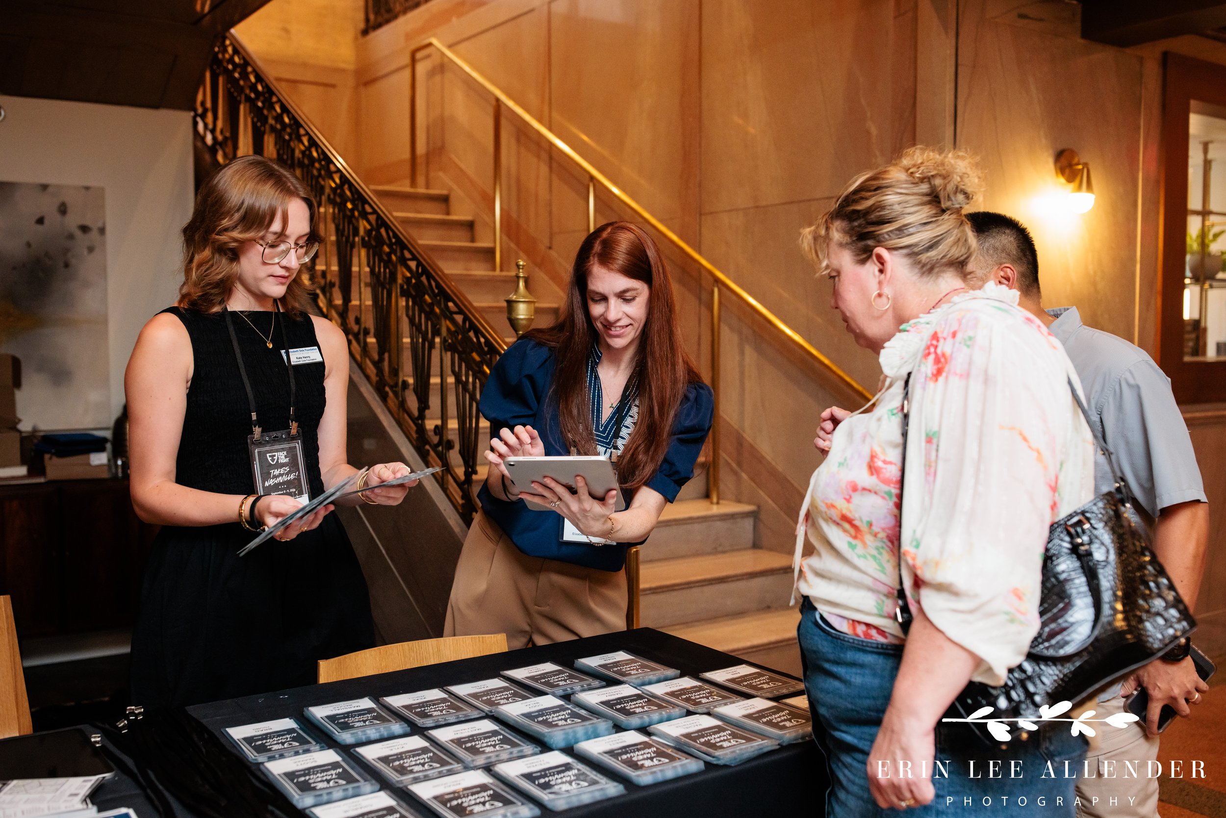 Nashville event photography — guests checking in at the Face the Fight registration desk at Noelle