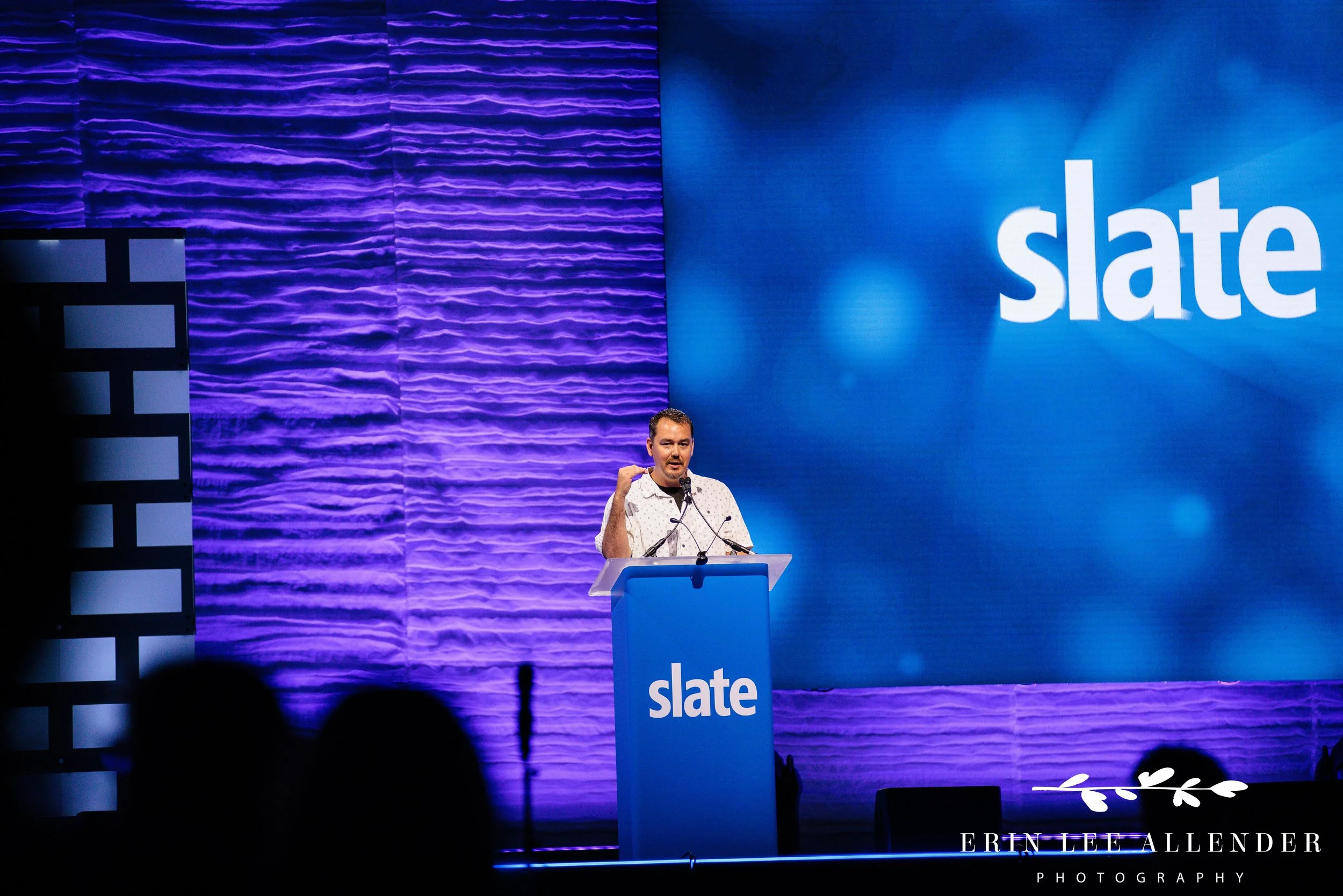 Nashville conference photographer — Post Captain consultant speaking from the podium during a Slate Summit breakout session