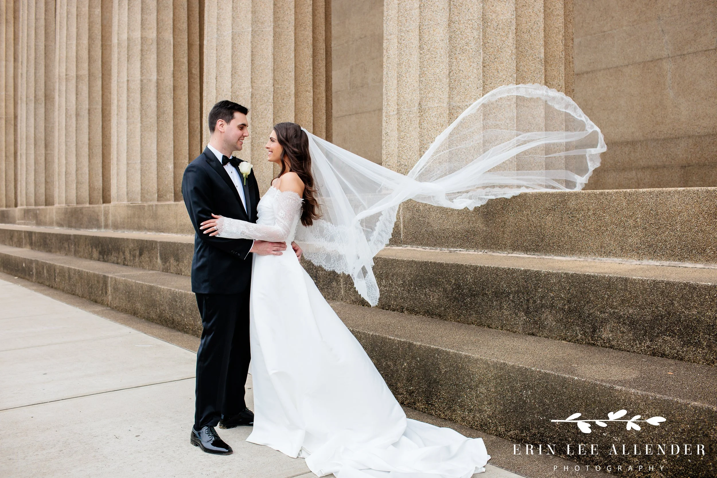 Nashville wedding photography — bride and groom portrait with the veil flowing in the wind at the Parthenon in Centennial Park
