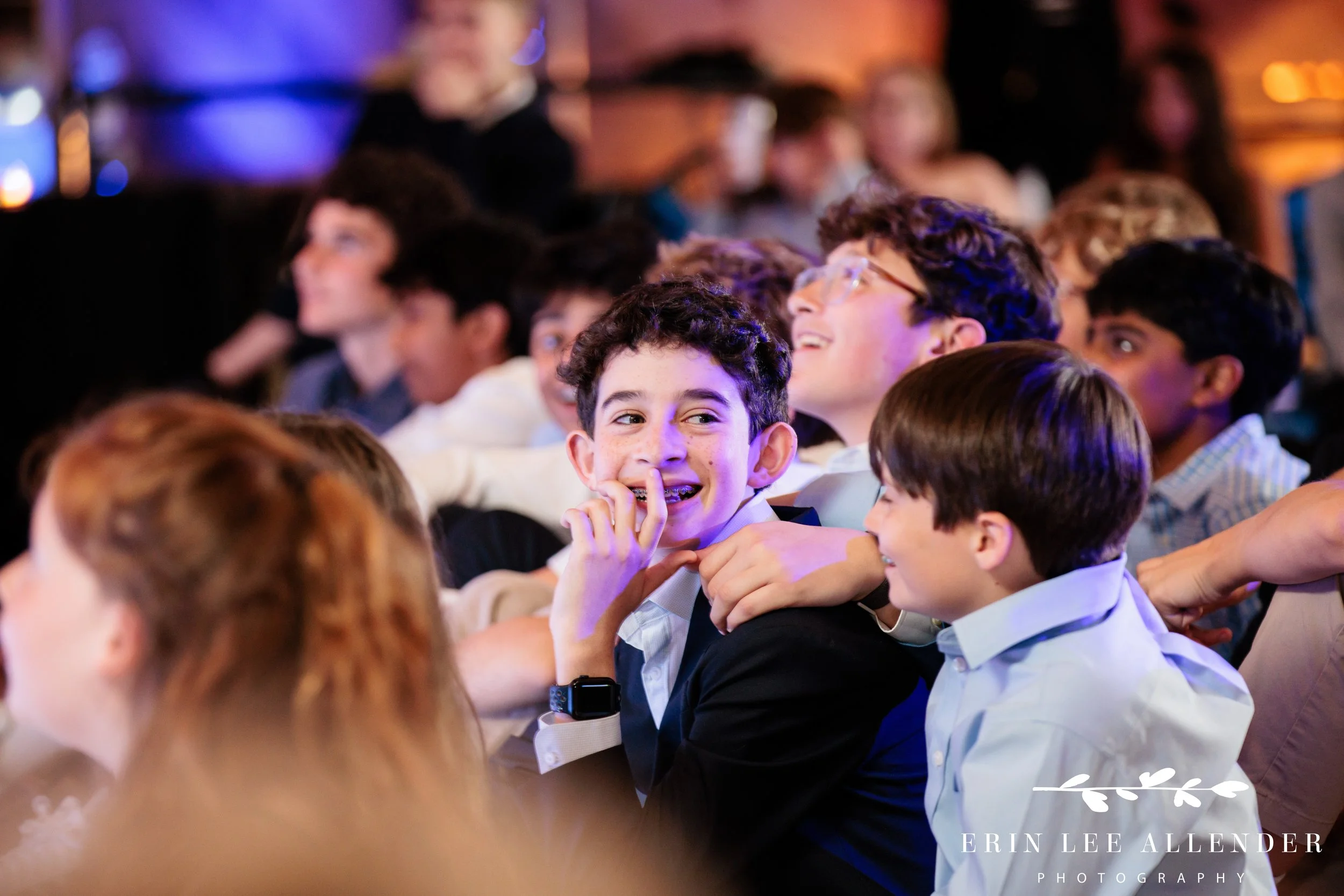 bar mitzvah looking at parents during video montage at W Nashville bar mitzvah reception