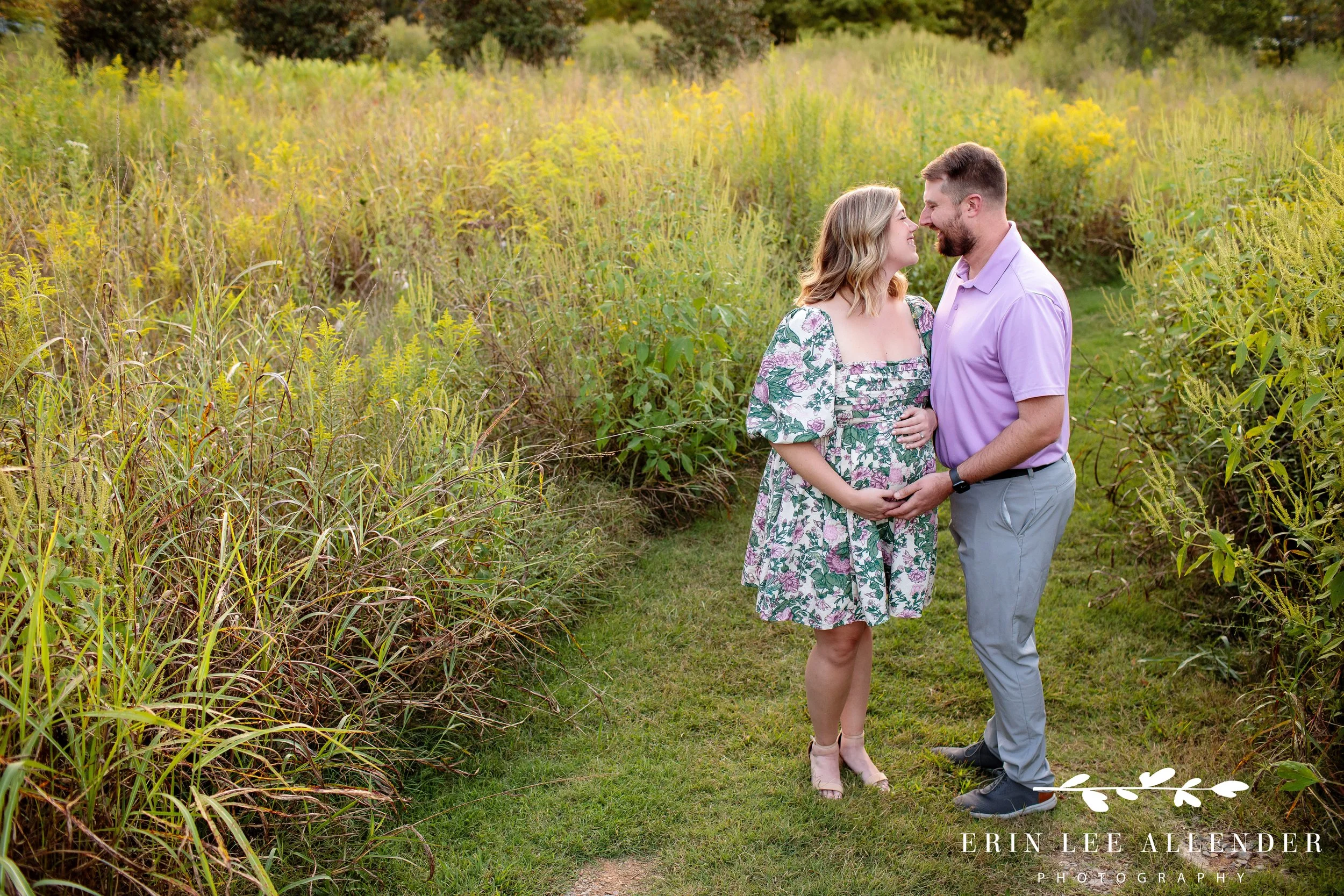 Expecting couple standing together on the grounds of Long Hollow Gardens in Gallatin, Tennessee, photographed by Nashville family photographer Erin Lee Allender