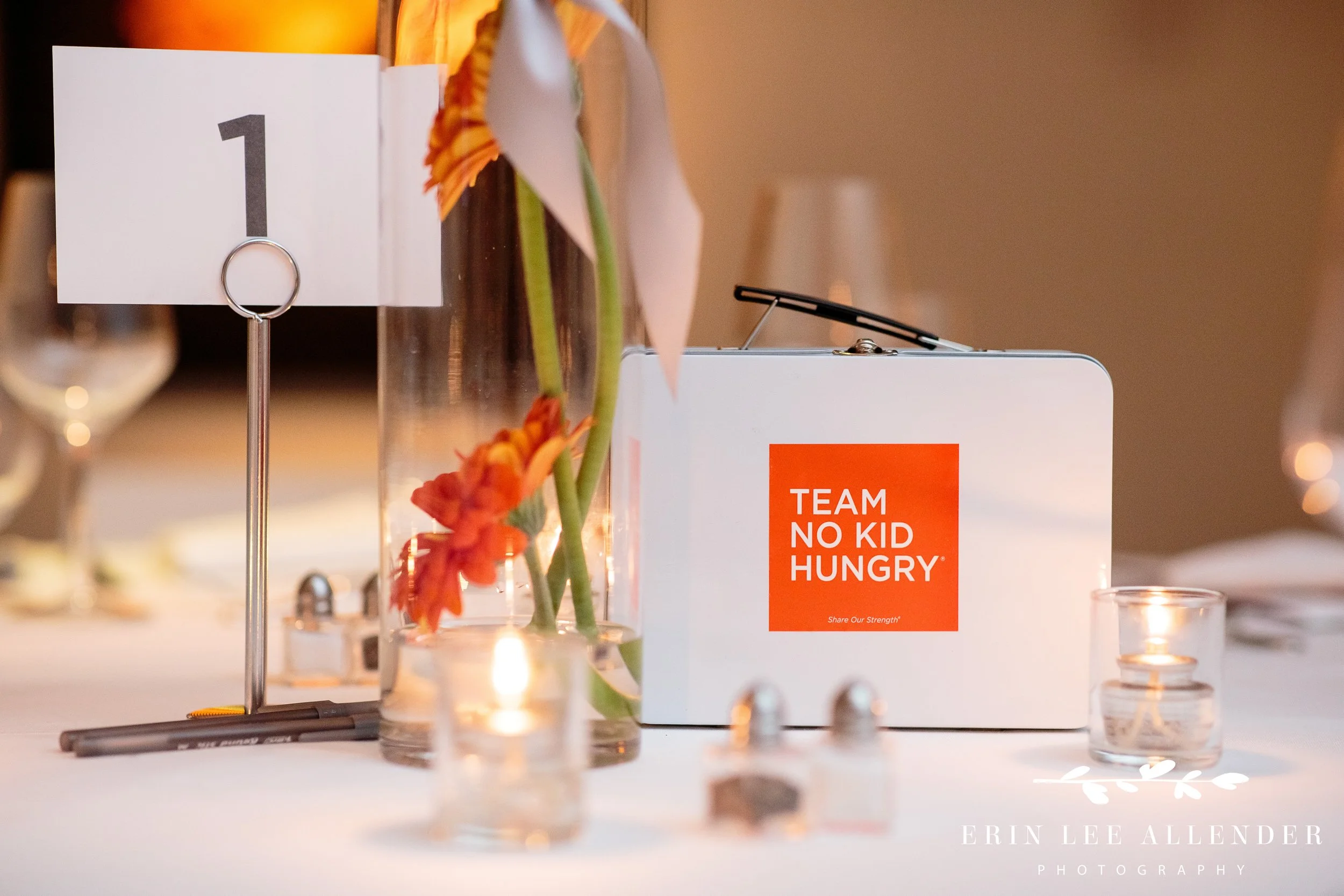 No Kid Hungry branded lunch box displayed at fundraising dinner in Nashville