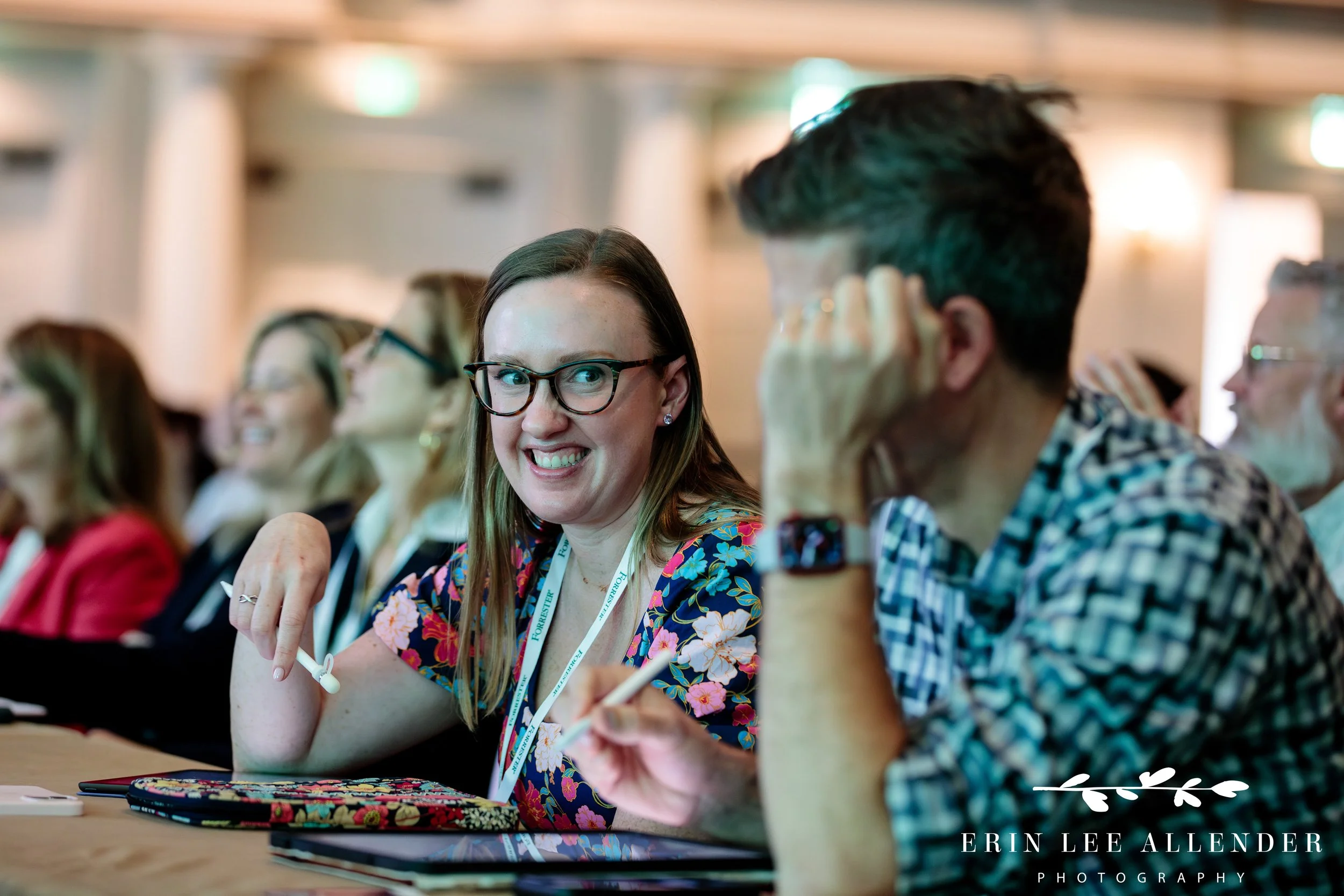 audience members laughing while engaging in conference presentation at opryland hotel