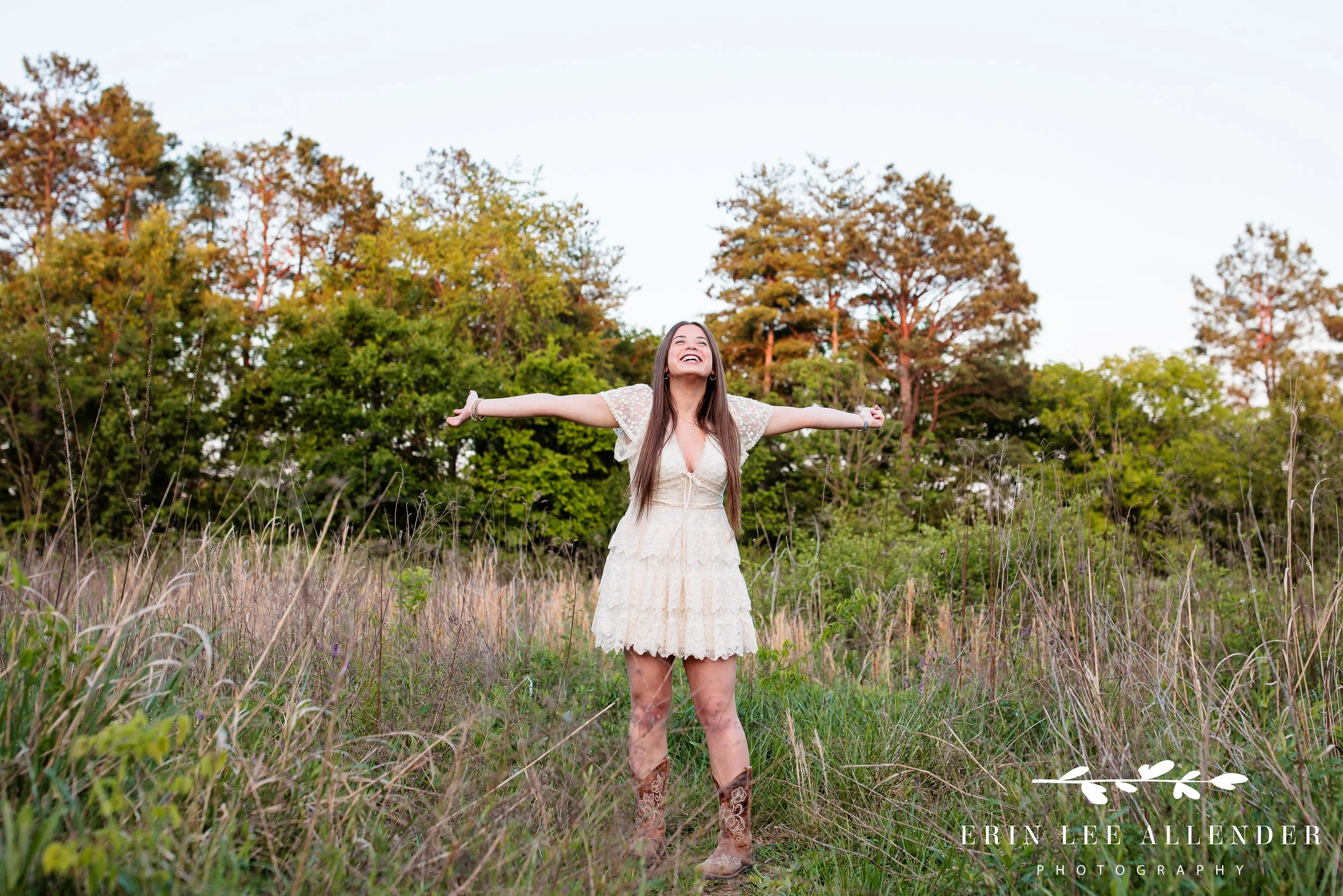 Outdoor Nashville senior session — high school senior spinning in an open field, natural light senior portraits Walton Ferry Arboretum