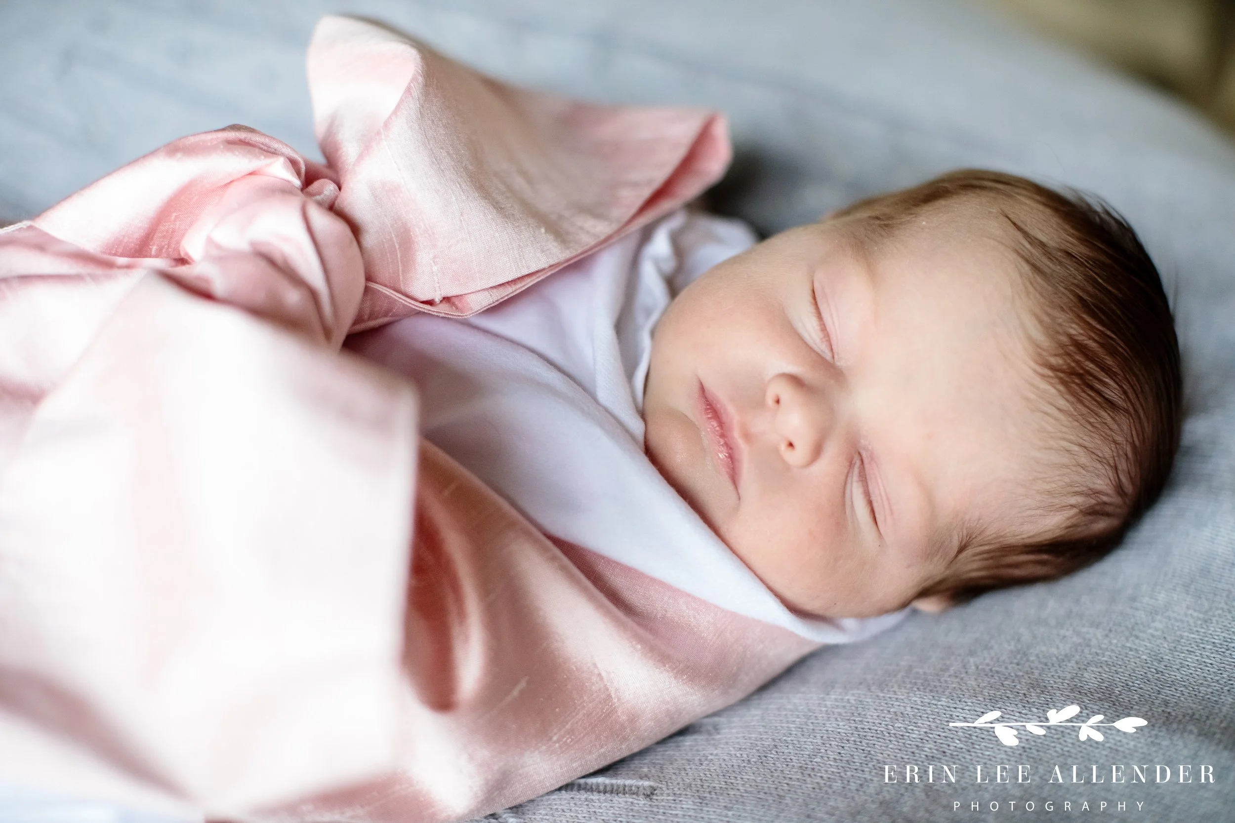 Newborn baby photographed alone on a soft blanket during an in-home Nashville family photography session