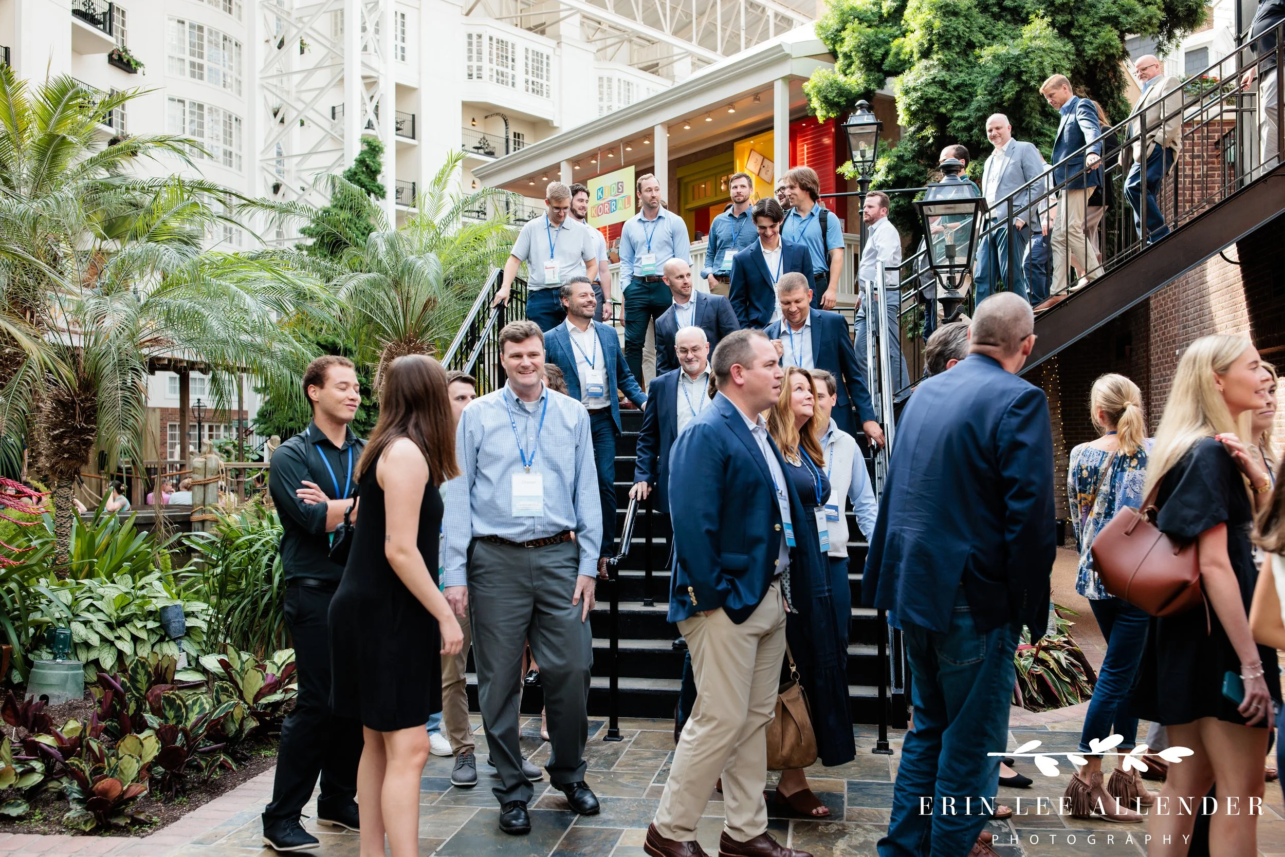 Delta Island Opryland cocktail party photography of guests descending the stairs and seeing the RubinBrown reception for the first time