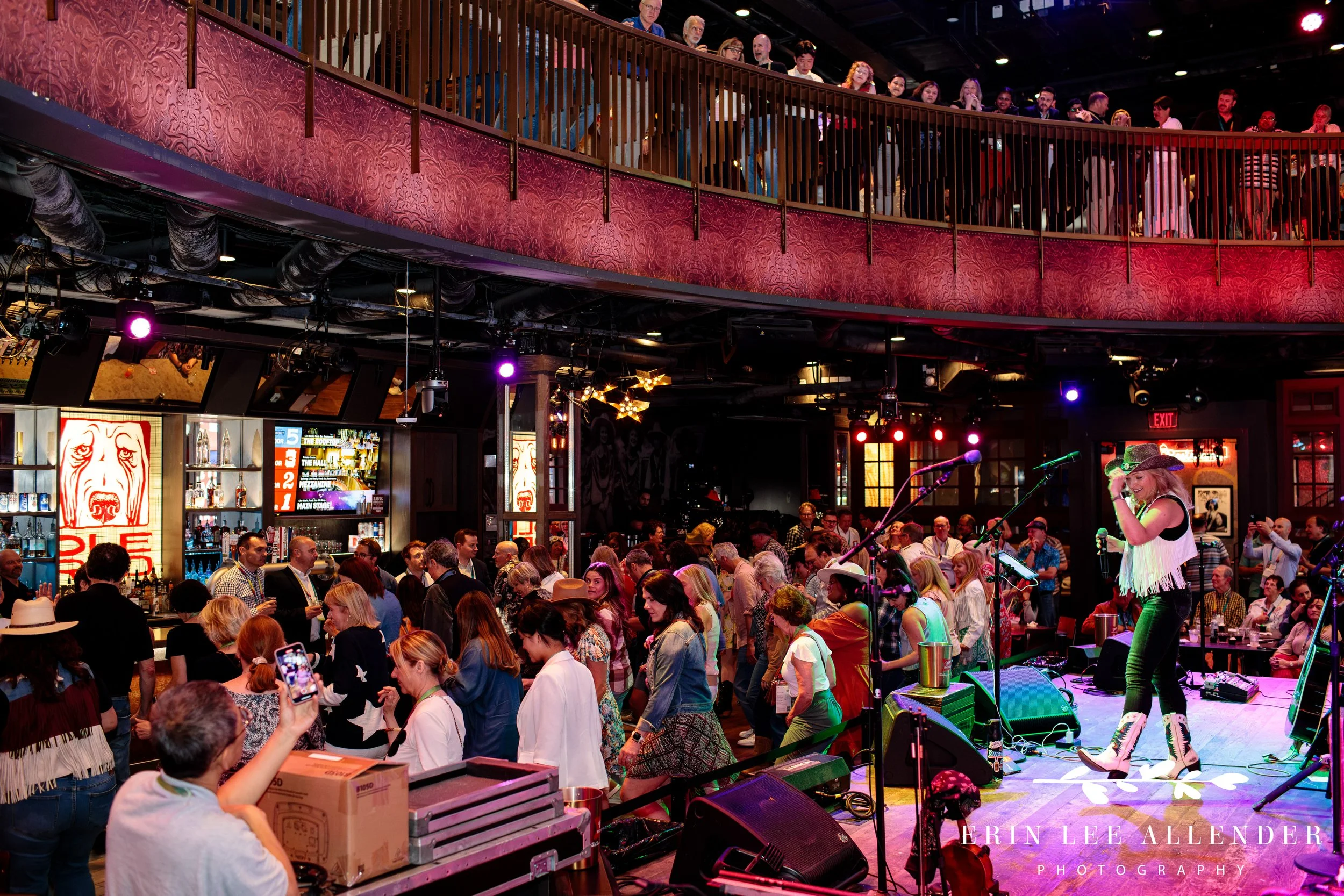 Wide shot of corporate attendees participating in line dancing instruction led by Music City Line Dance with Darcy Lyn at Ole Red Downtown Nashville