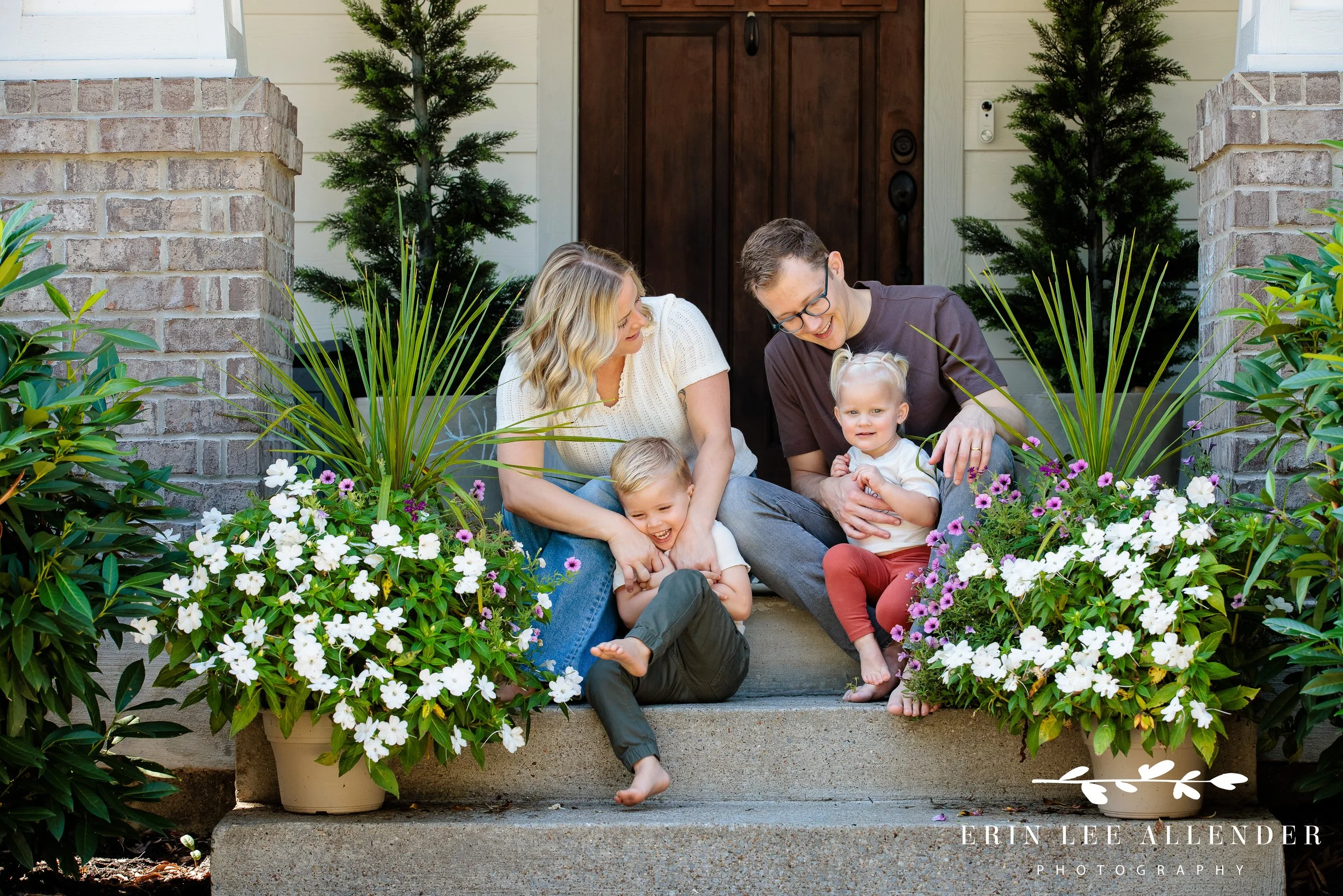 Photograph of mom tickling little boy during in-home family session in nashville