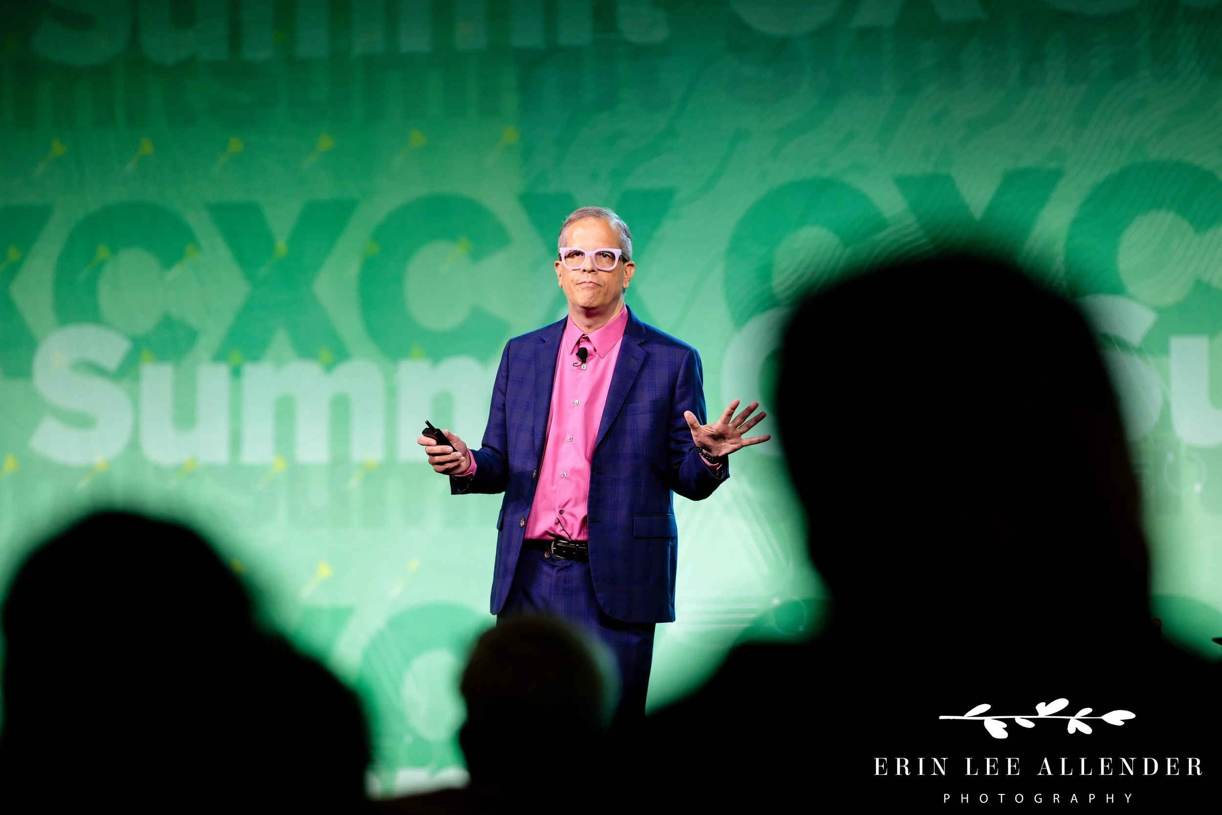 speaker engaging audience with gesture during conference presentation at opryland hotel