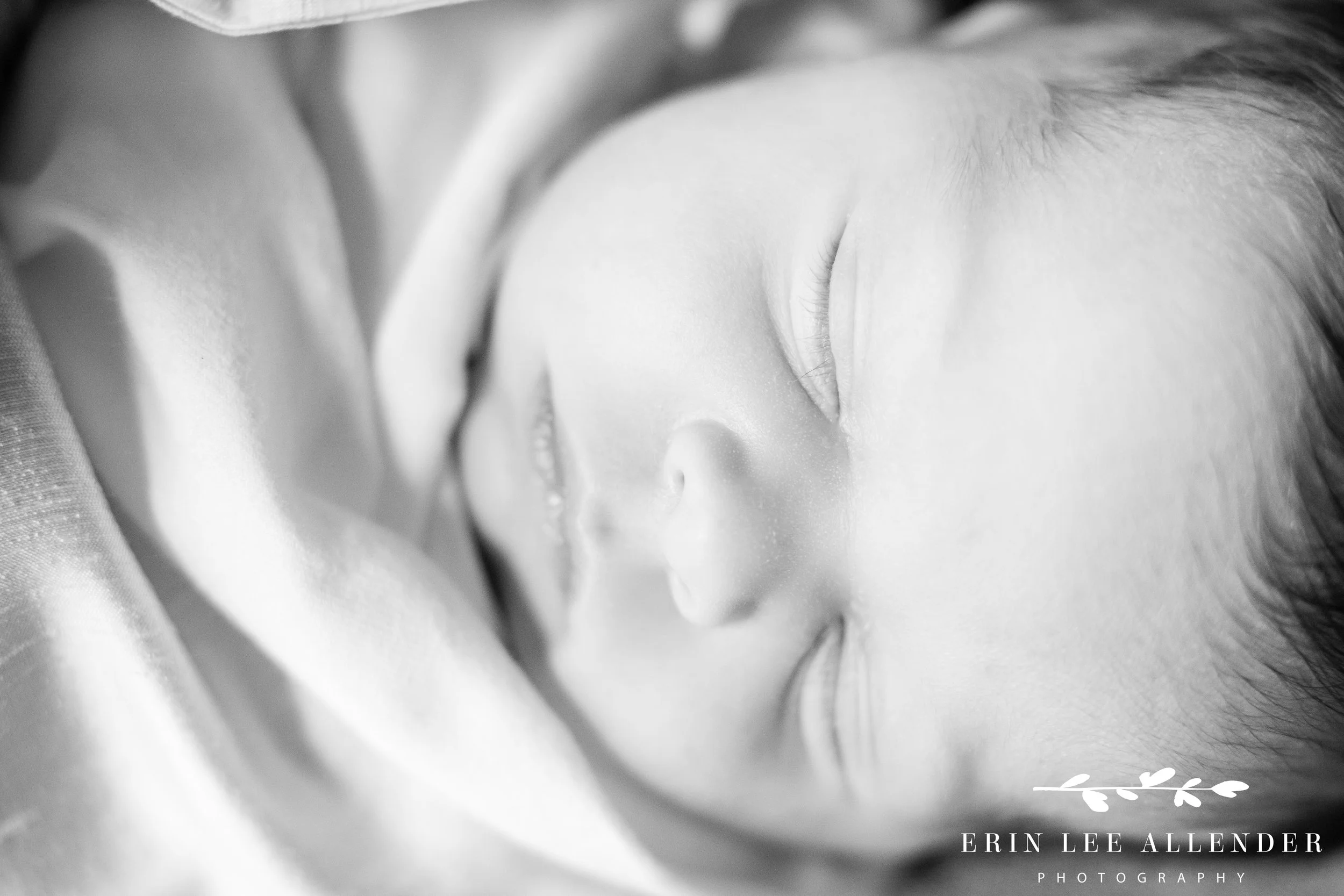Close-up of newborn baby’s nose during an in-home Nashville family photography session.