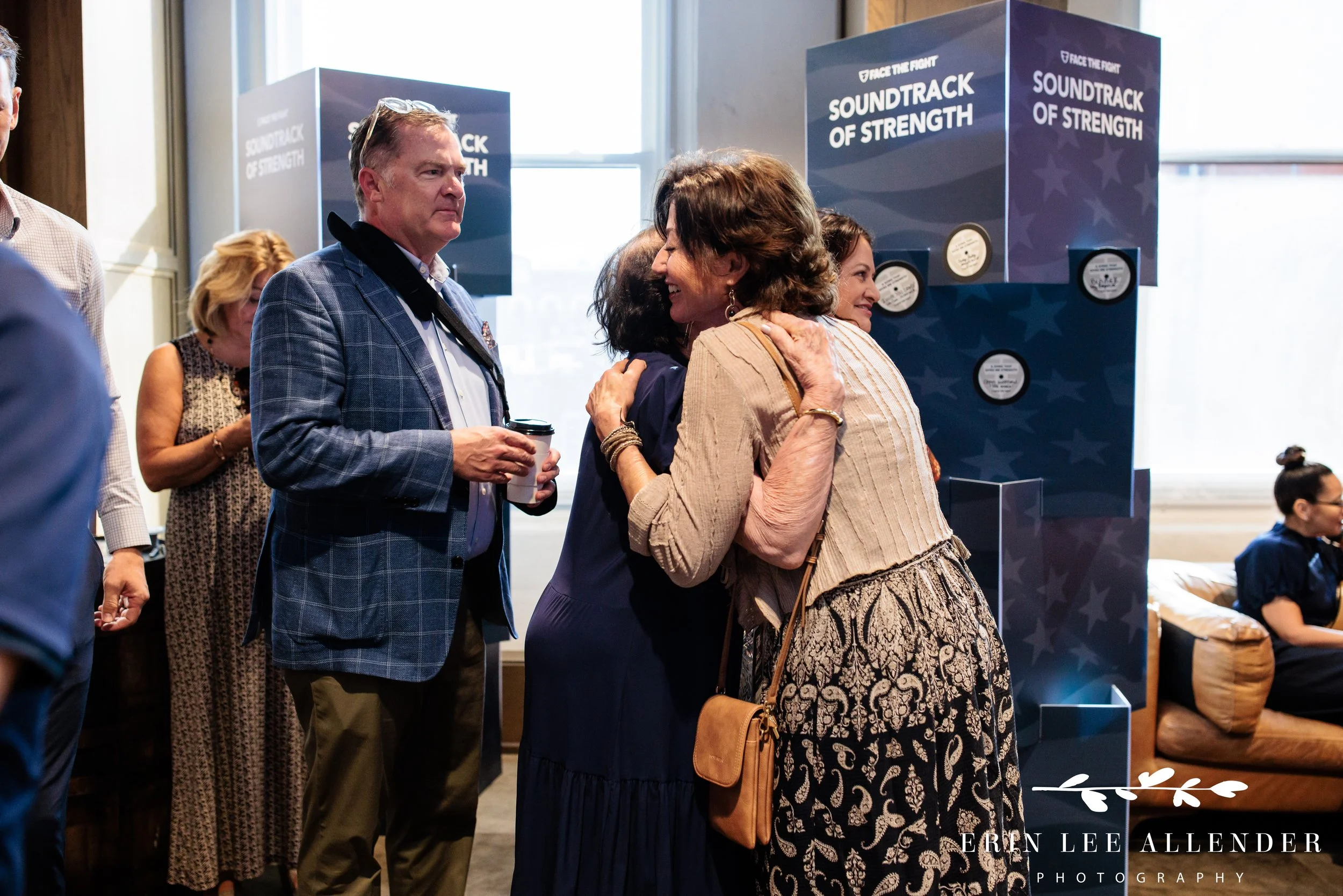 Nashville event photographer — Amy Grant hugging a guest at Face the Fight's Louder Together at Ole Red