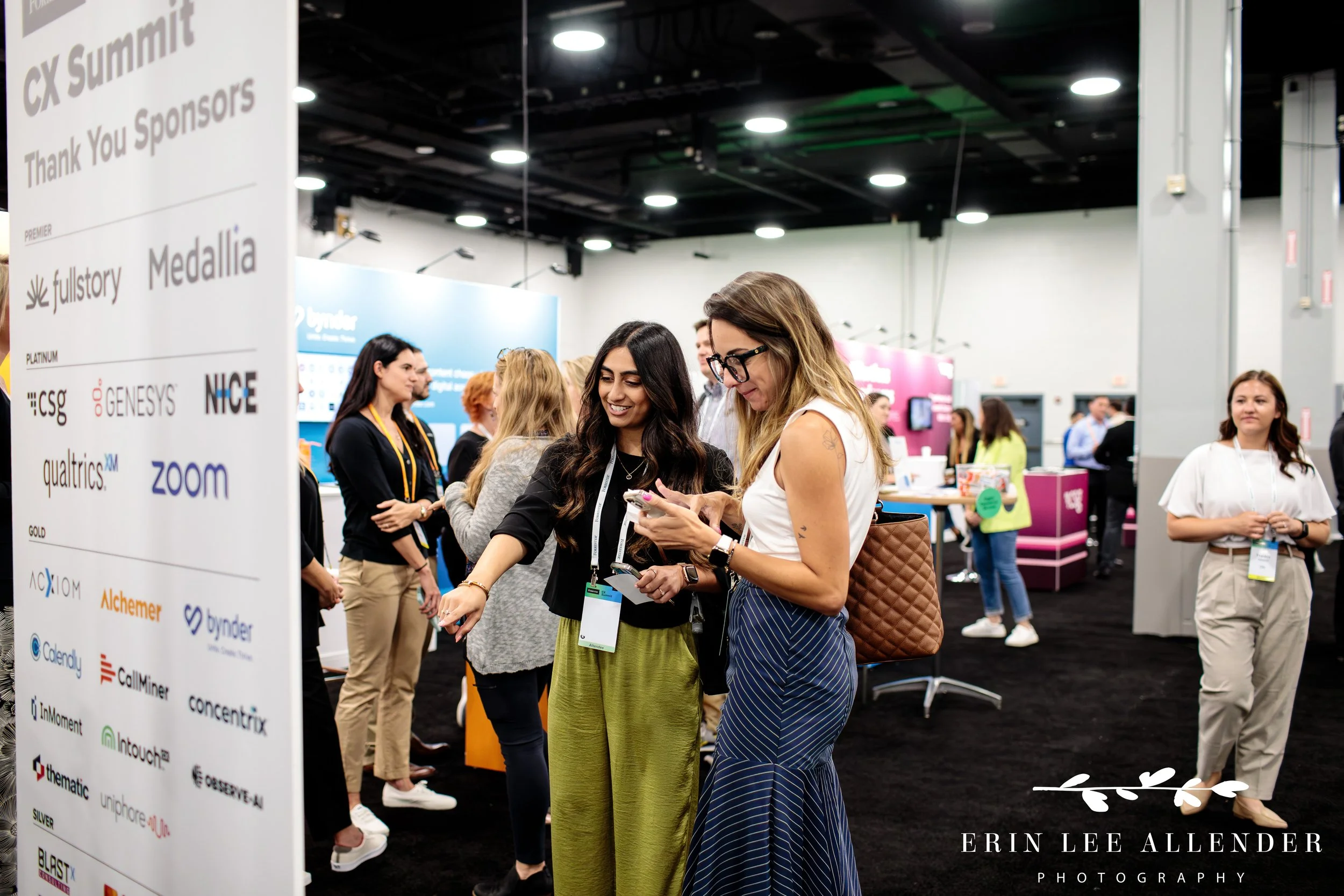 Attendees reviewing products and engaging with vendors in expo hall at CX conference Gaylord Opryland Hotel