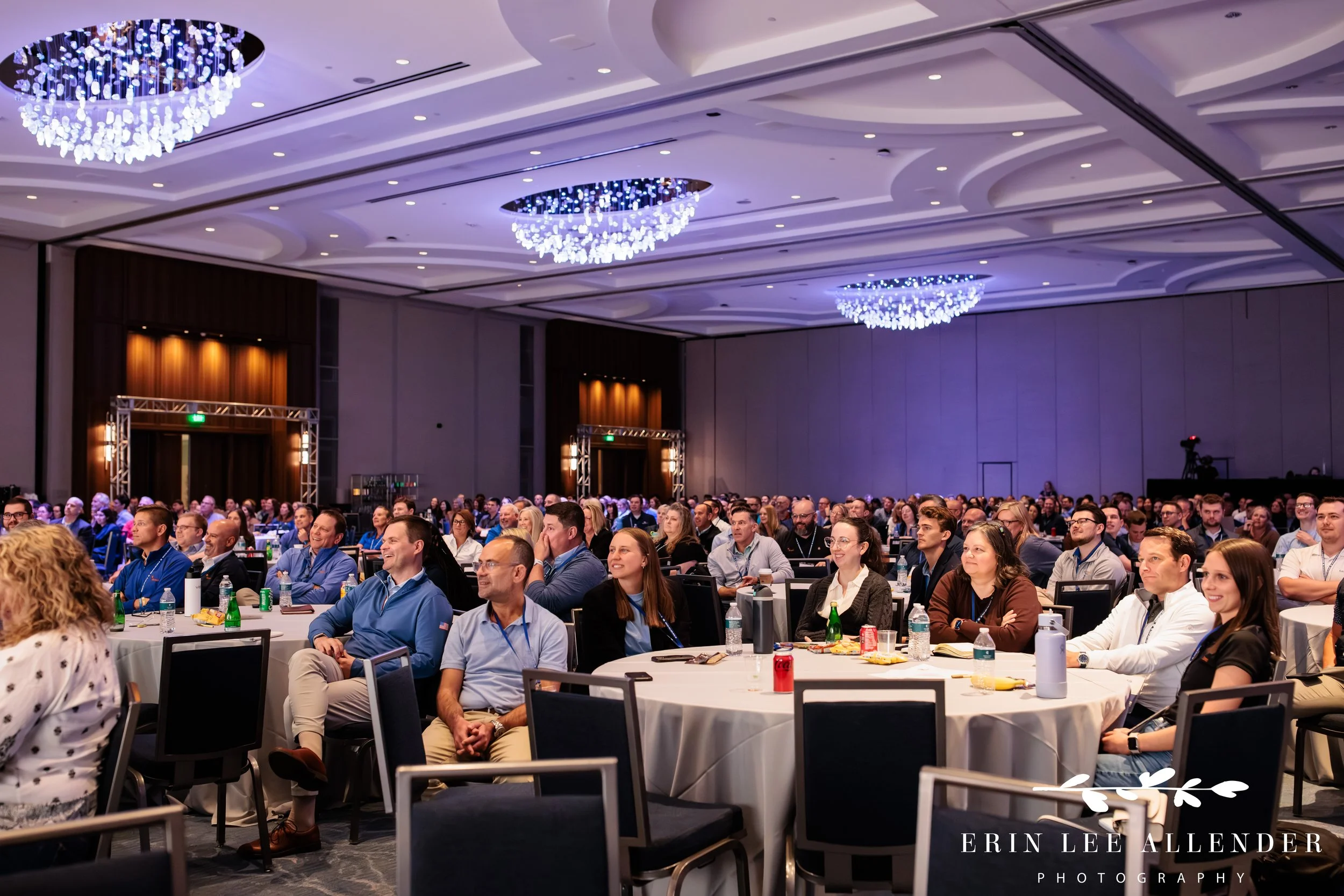 Nashville corporate event photographer capturing the full room watching a keynote session at RubinBrown's conference at Gaylord Opryland Resort
