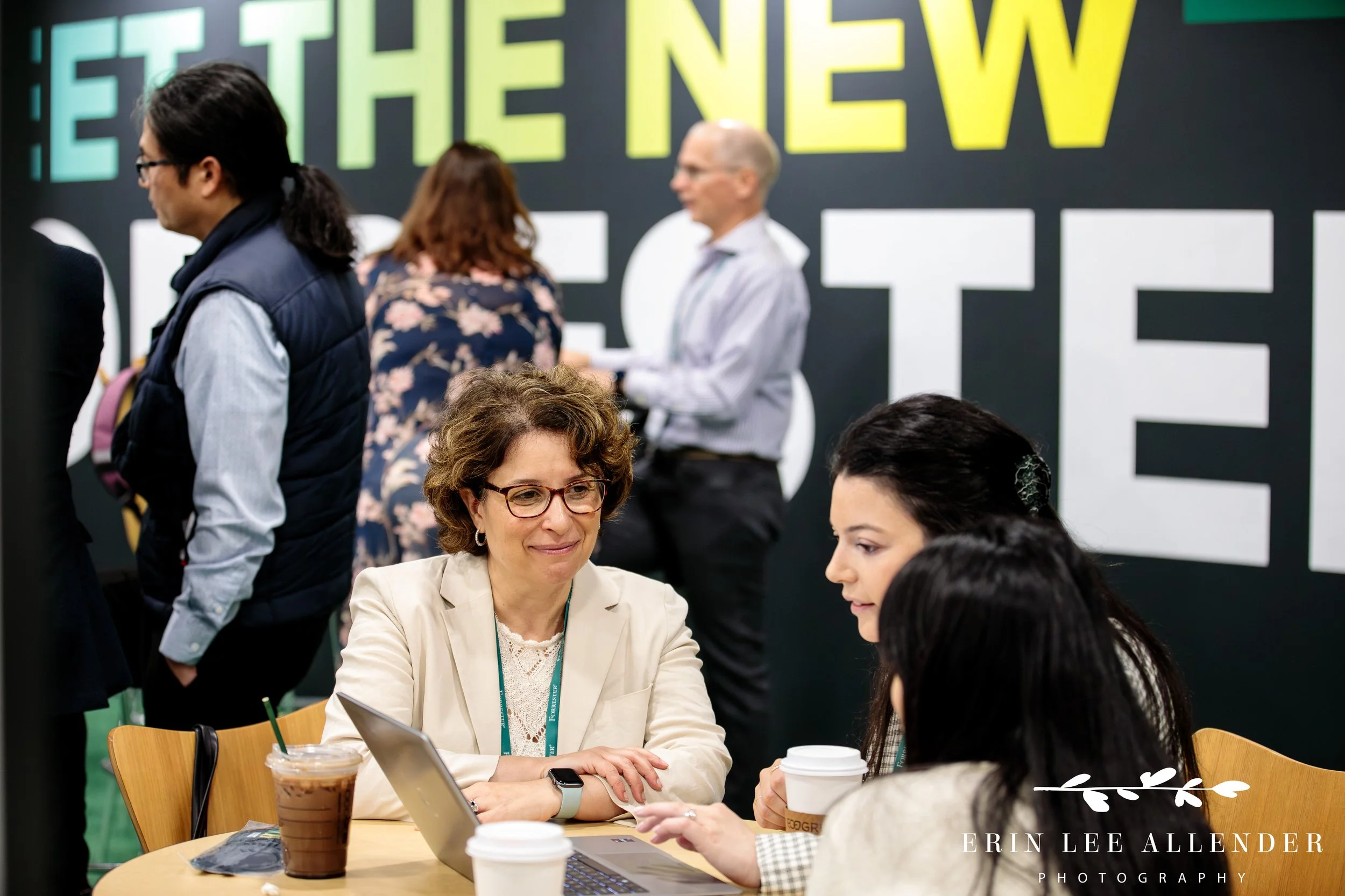 Attendees engaged in networking at vendor booths in the expo hall during corporate CX conference at Gaylord Opryland Hotel