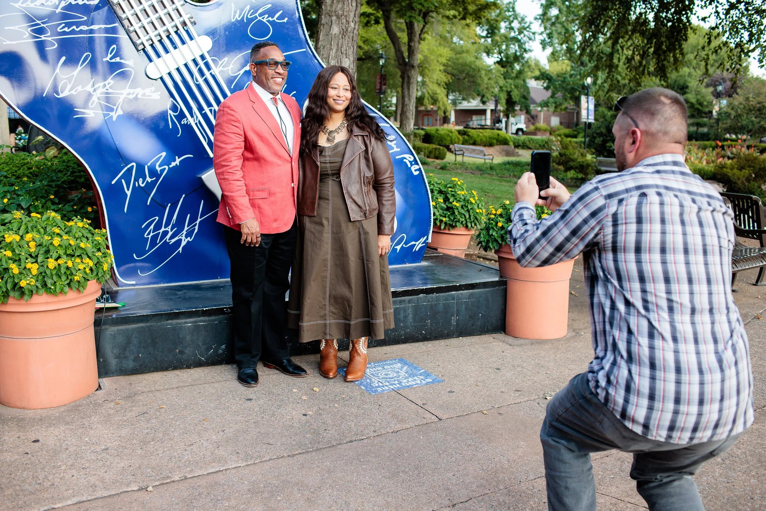 Guests getting their photograph taken in front of Grand Ole Opry Guitars during Face the Fight Night