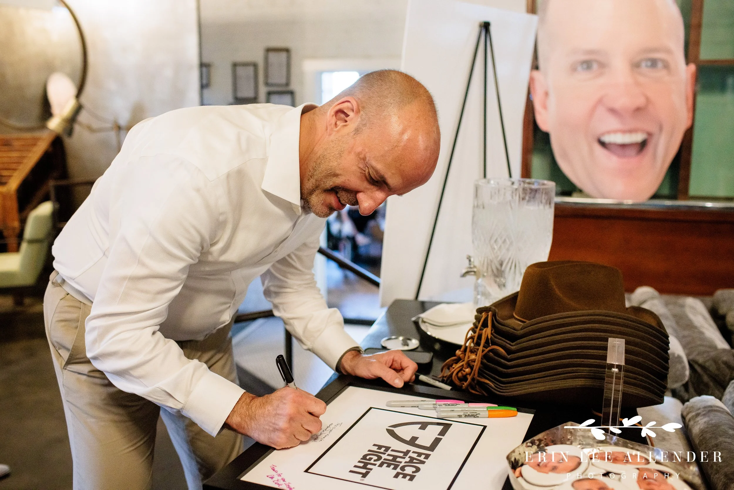 Crowd of guests enjoying conversations during Face the Fight welcome party, Pinewood Social Nashville