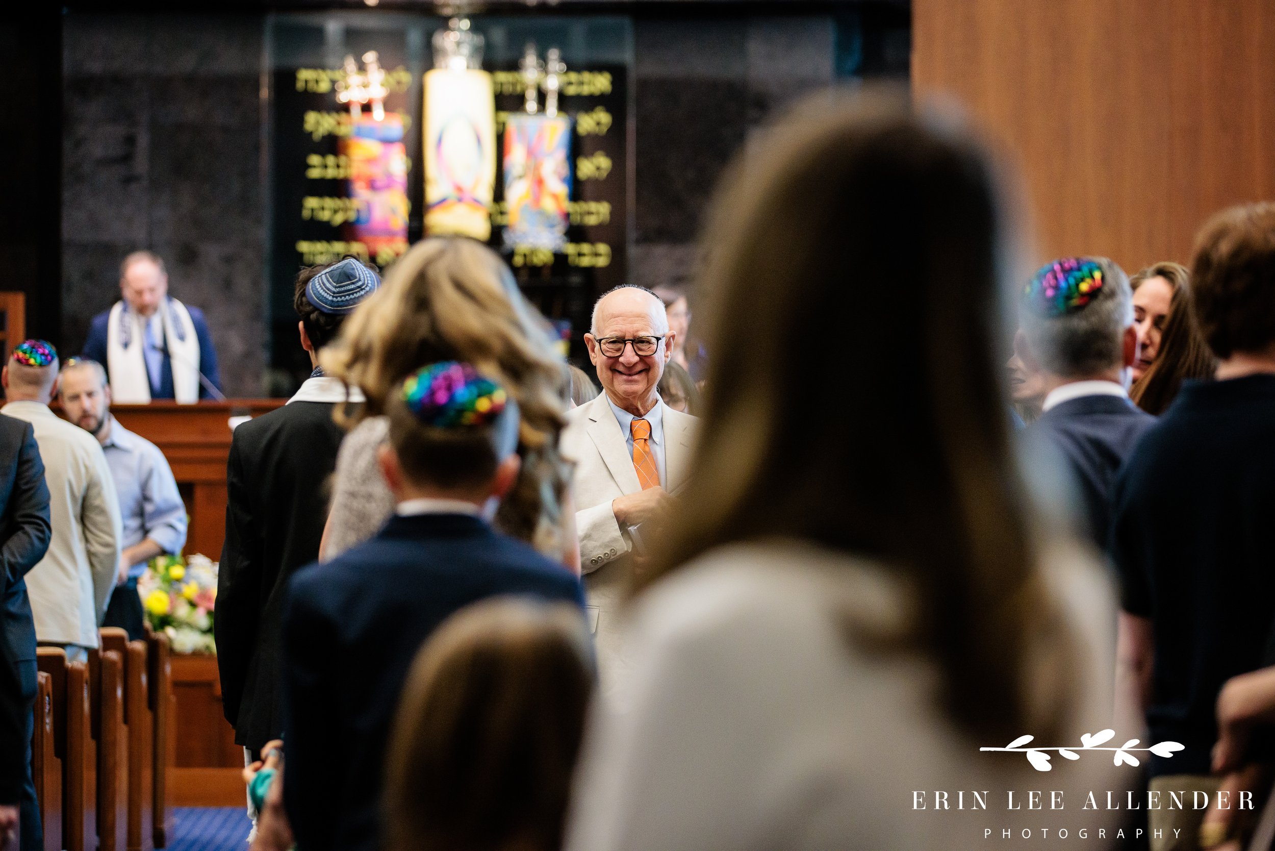 Guest reaching to touch Torah during processional