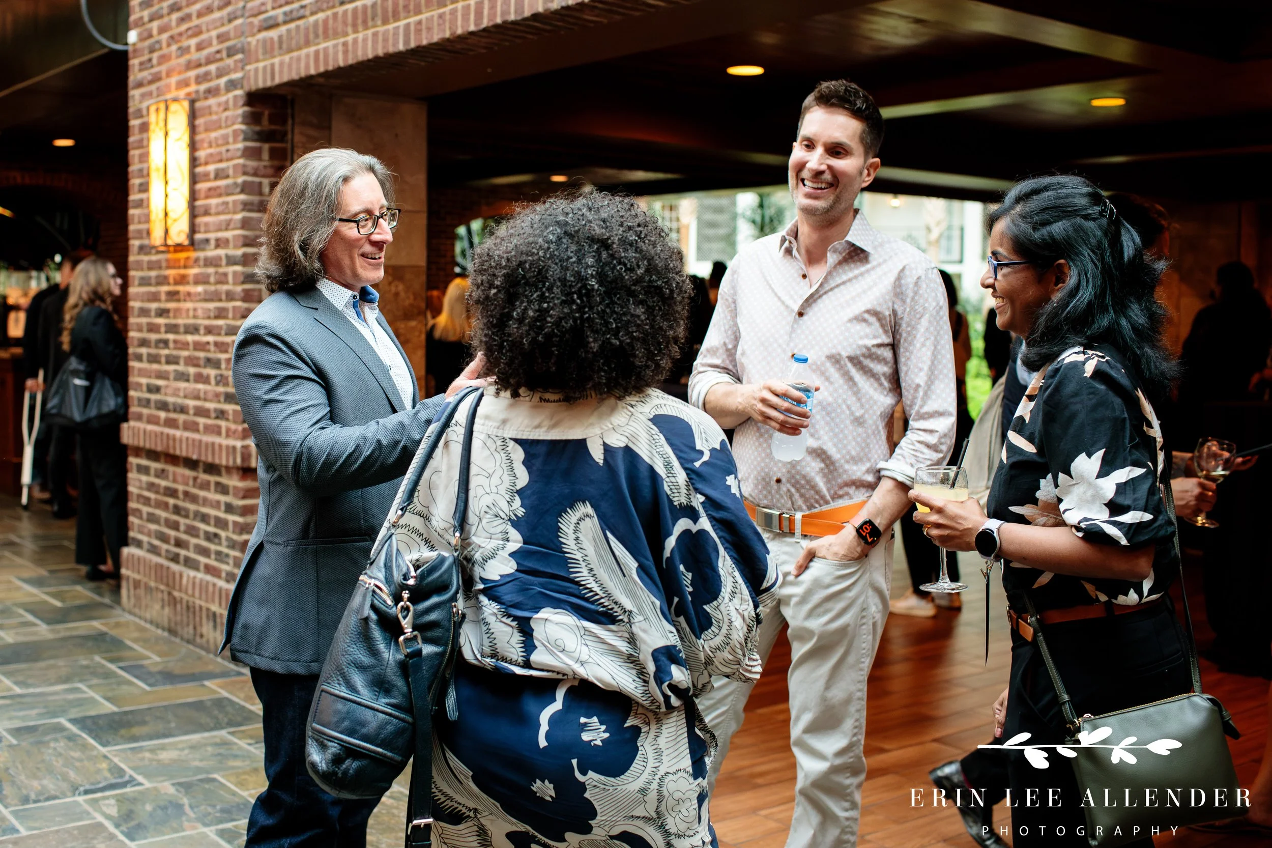 Candid moment of executive networking at Opryland Hotel event
