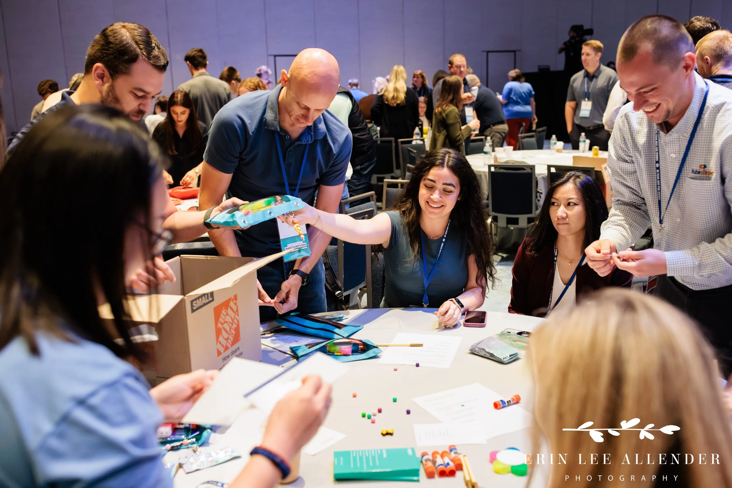Opryland Hotel conference photography of a group finishing up pencil bags during RubinBrown's service project