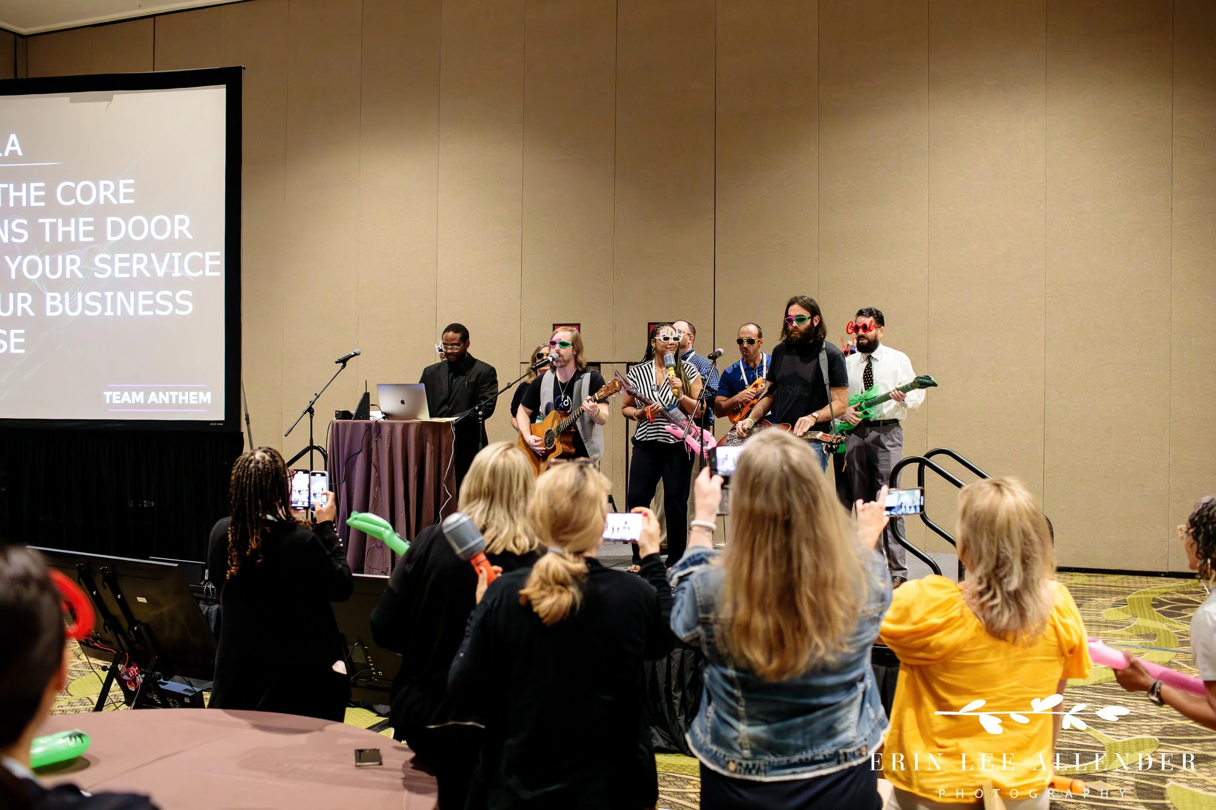Nashville conference photographer — attendee writing lyrics during a Song Division team building breakout session at the Forrester CX Conference, Gaylord Opryland Hotel