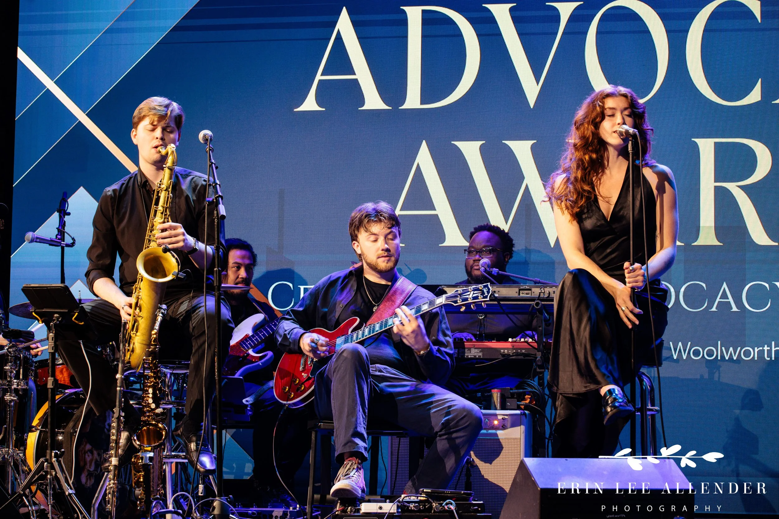 Nashville corporate event photographer — Moga Family Band performing live on stage at wine and spirits advocacy awards, Woolworth Theatre Nashville