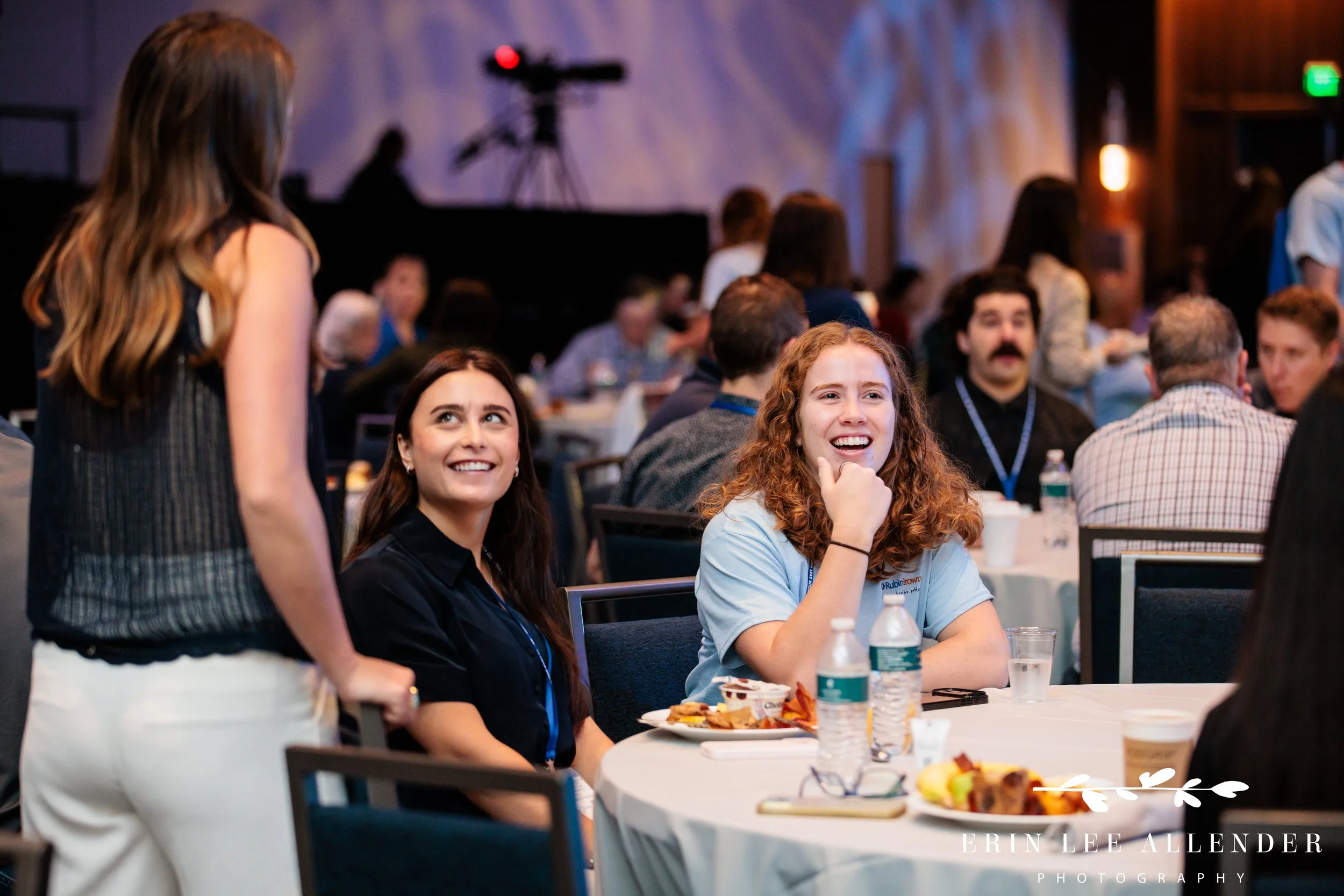 Opryland Hotel conference photography of attendees laughing together during lunch at RubinBrown's conference