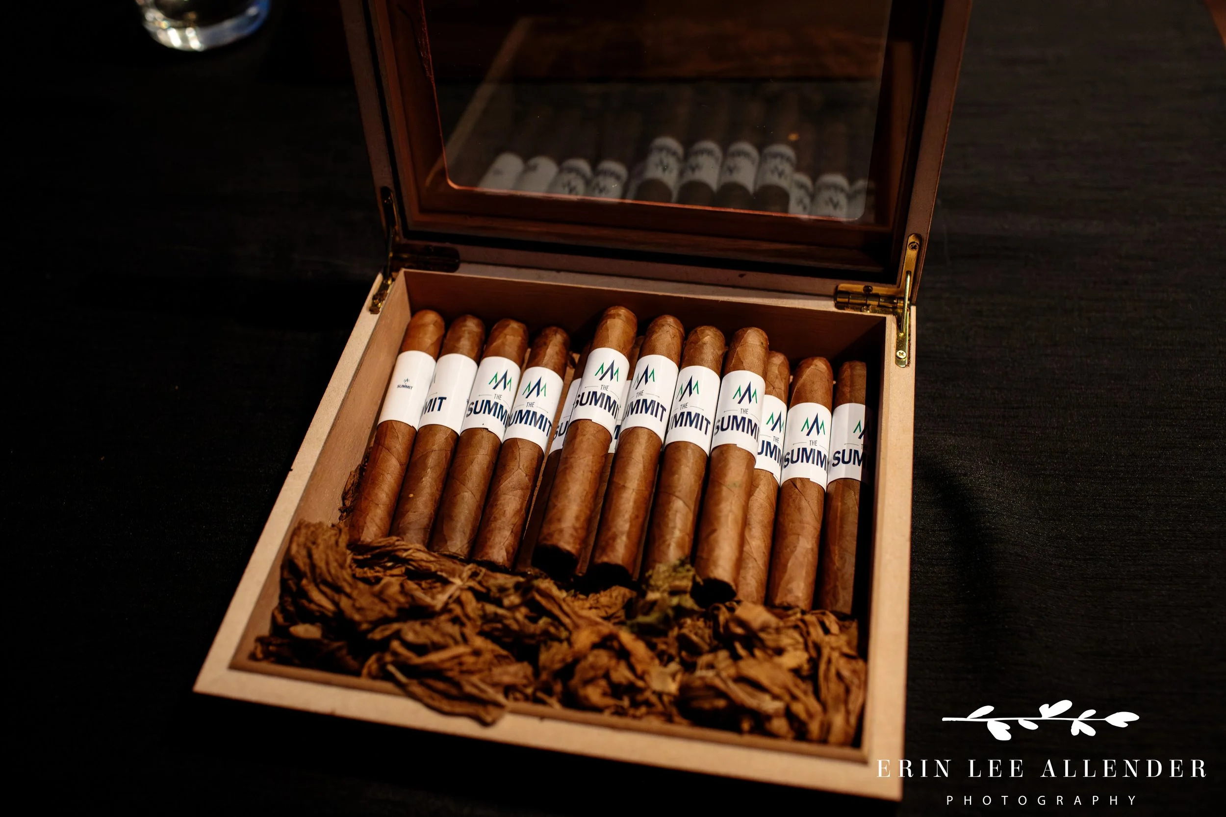 Nashville corporate event photography — close-up of branded custom cigars at CBIZ Nashville Summit closing party at Country Music Hall of Fame
