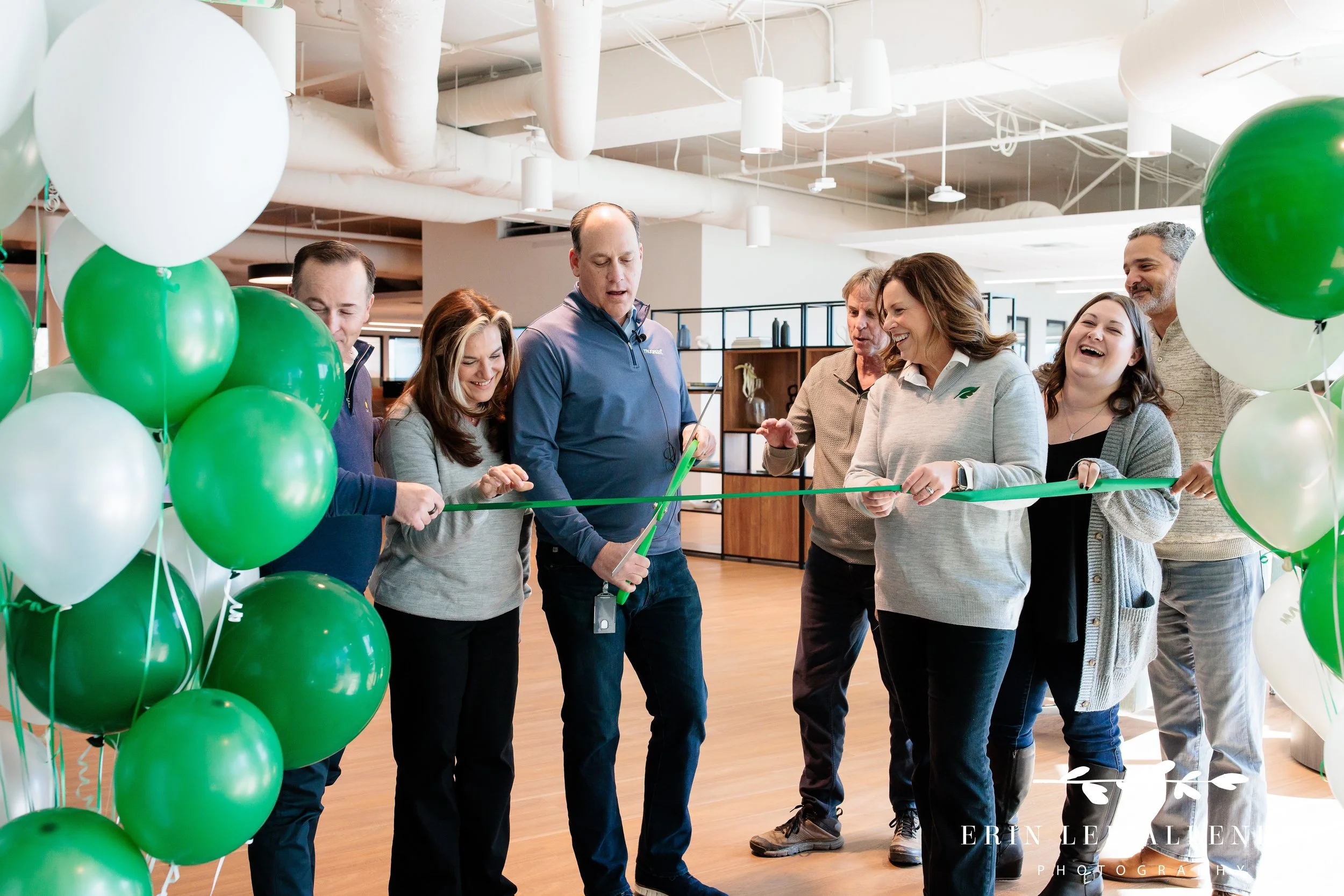 Nashville ribbon cutting photography — CEO cutting ribbon at TruGreen office expansion ceremony in Middle Tennessee
