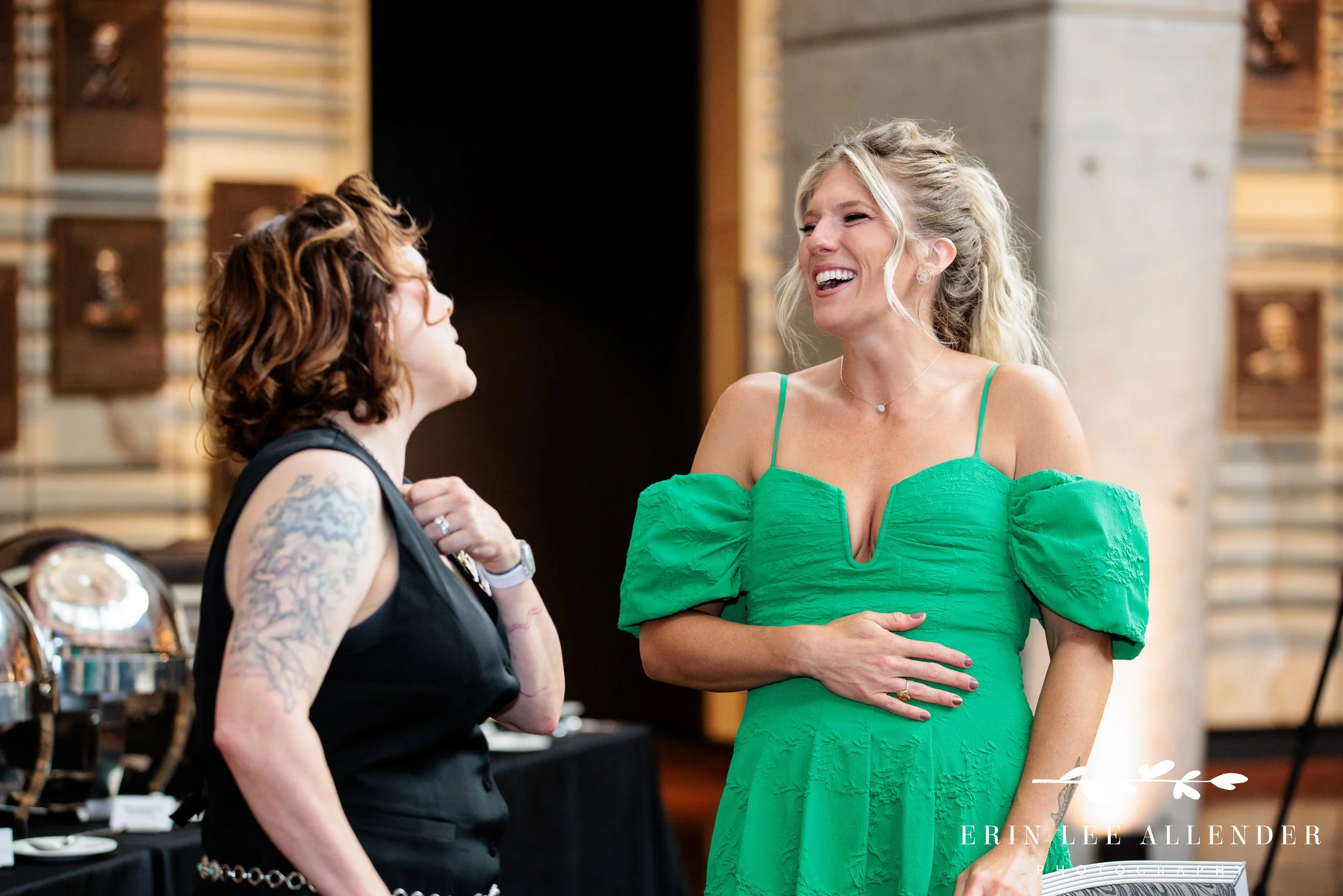 Guests laughing during cocktail hour of awards dinner in rotunda at country music hall of fame