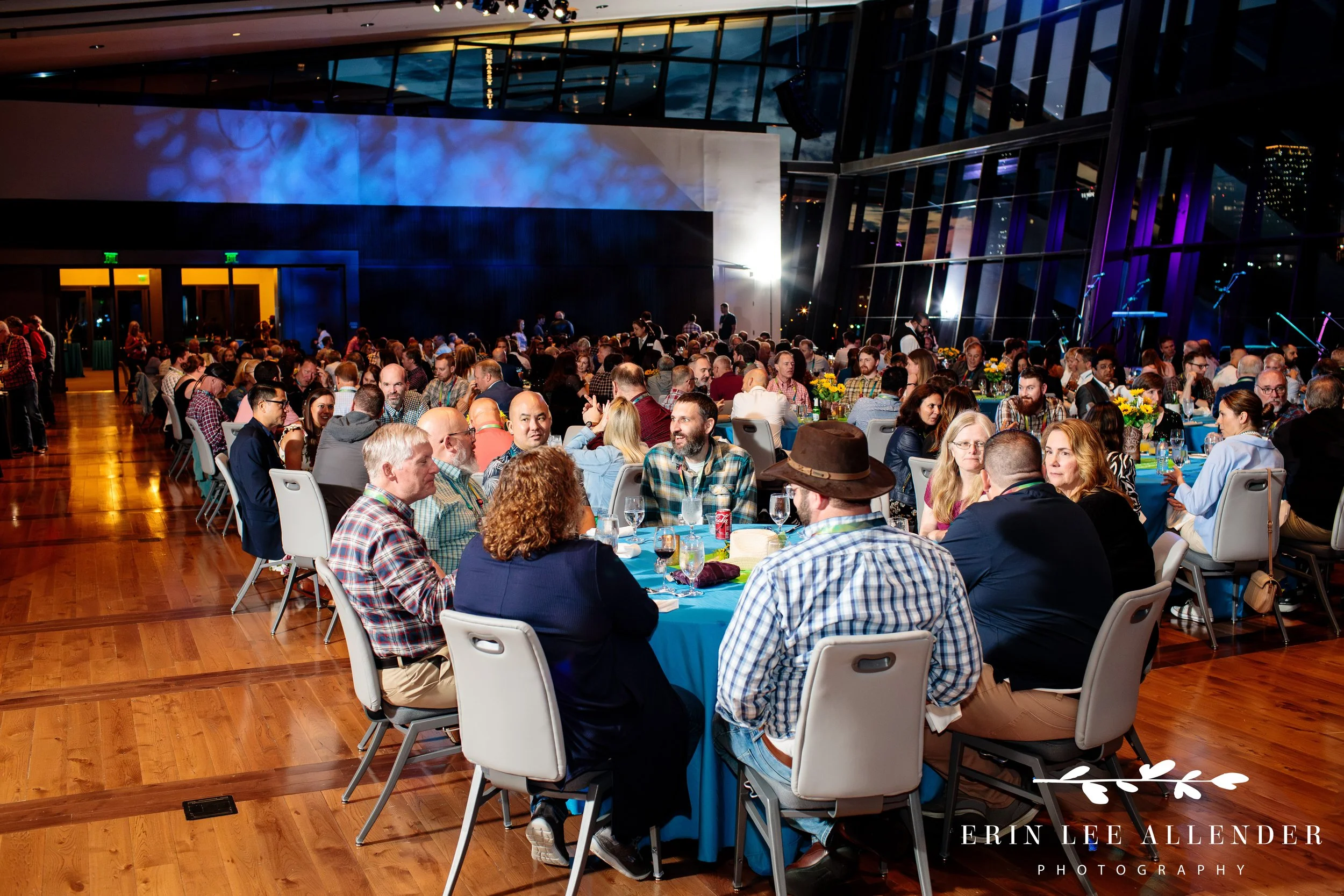 Wide room shot of conference attendees mingling in the Country Music Hall of Fame event hall