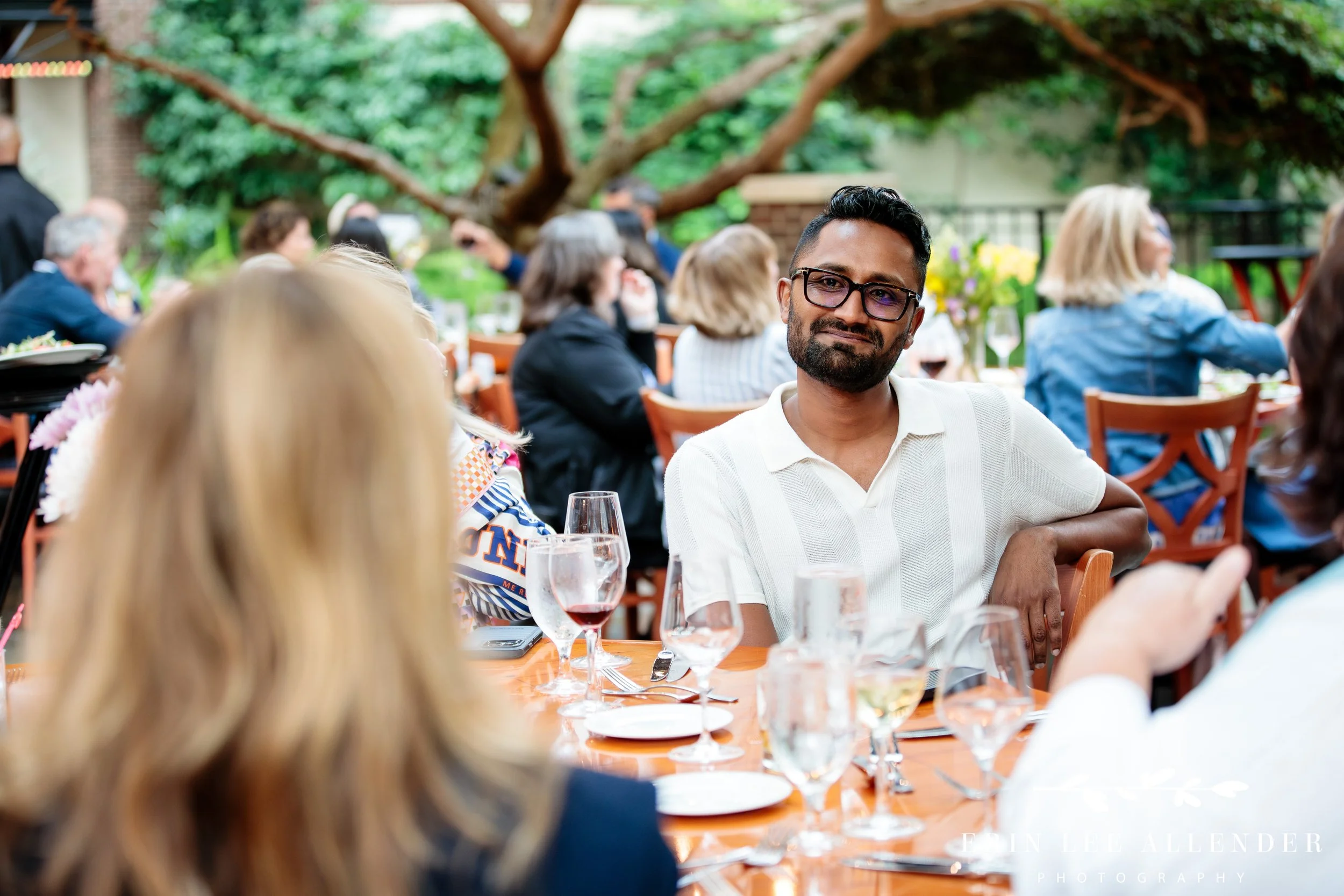 Conference attendees seated at dinner table talking at Opryland Hotel
