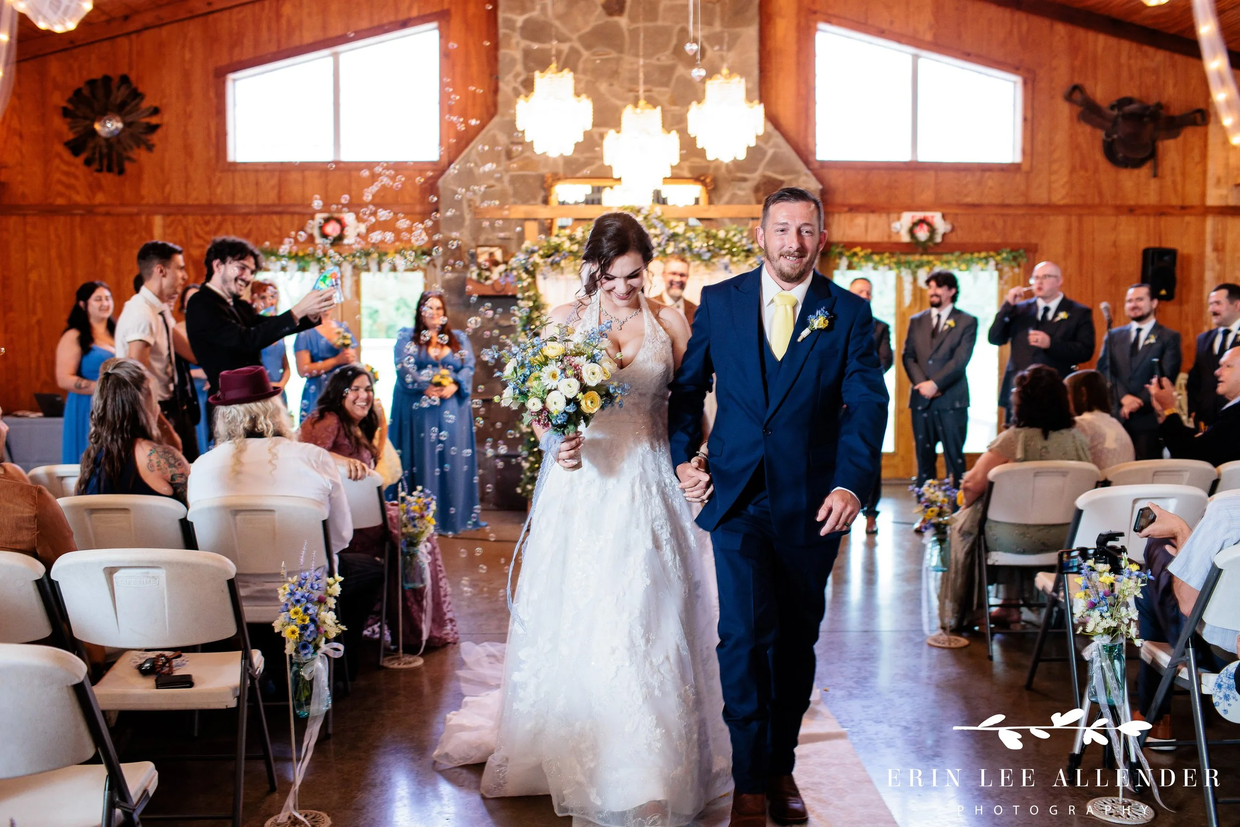 bride and groom walk down aisle