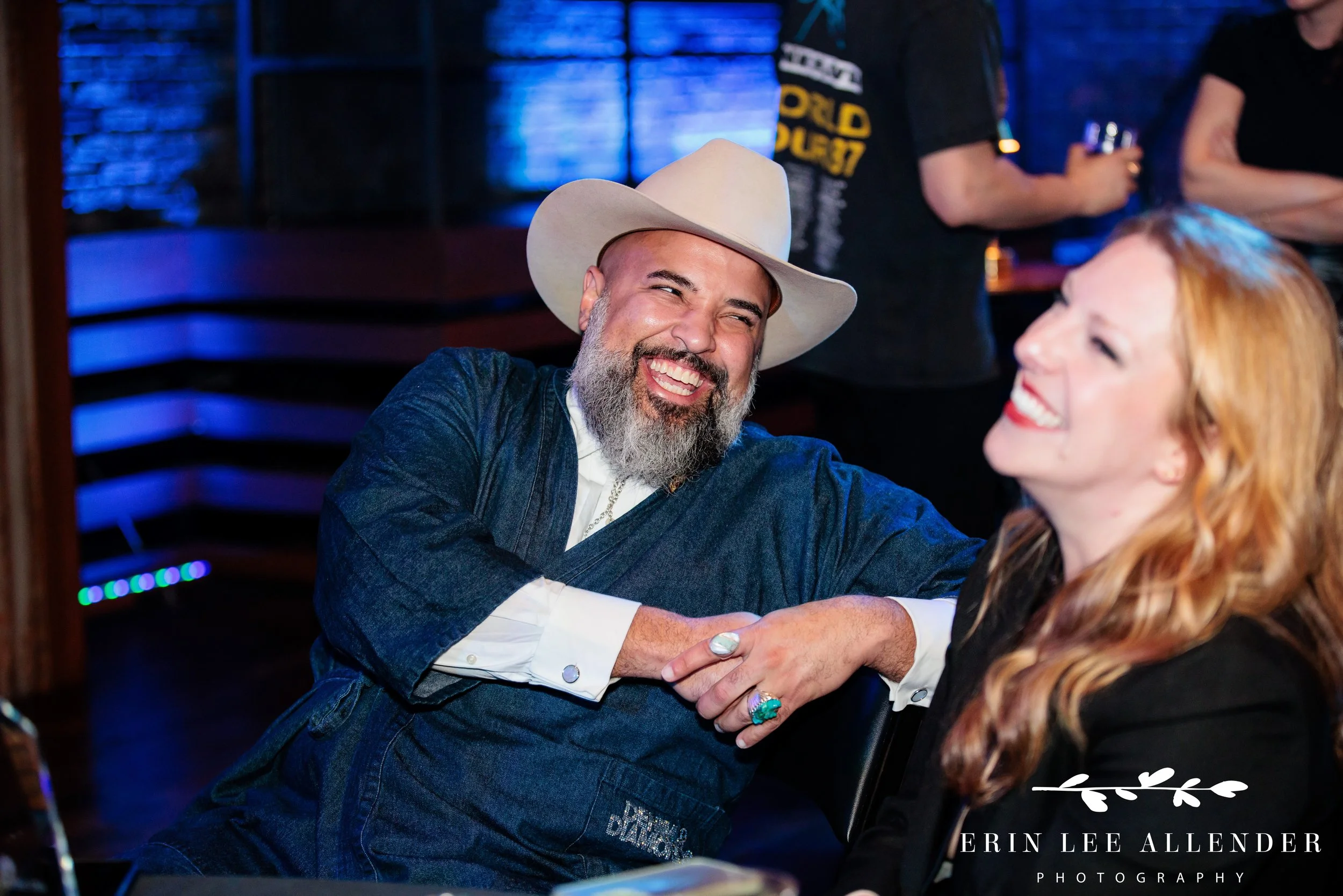 Nashville corporate event photography — wine and spirits ambassador laughing in seat at advocacy awards dinner, Woolworth Theatre Nashville