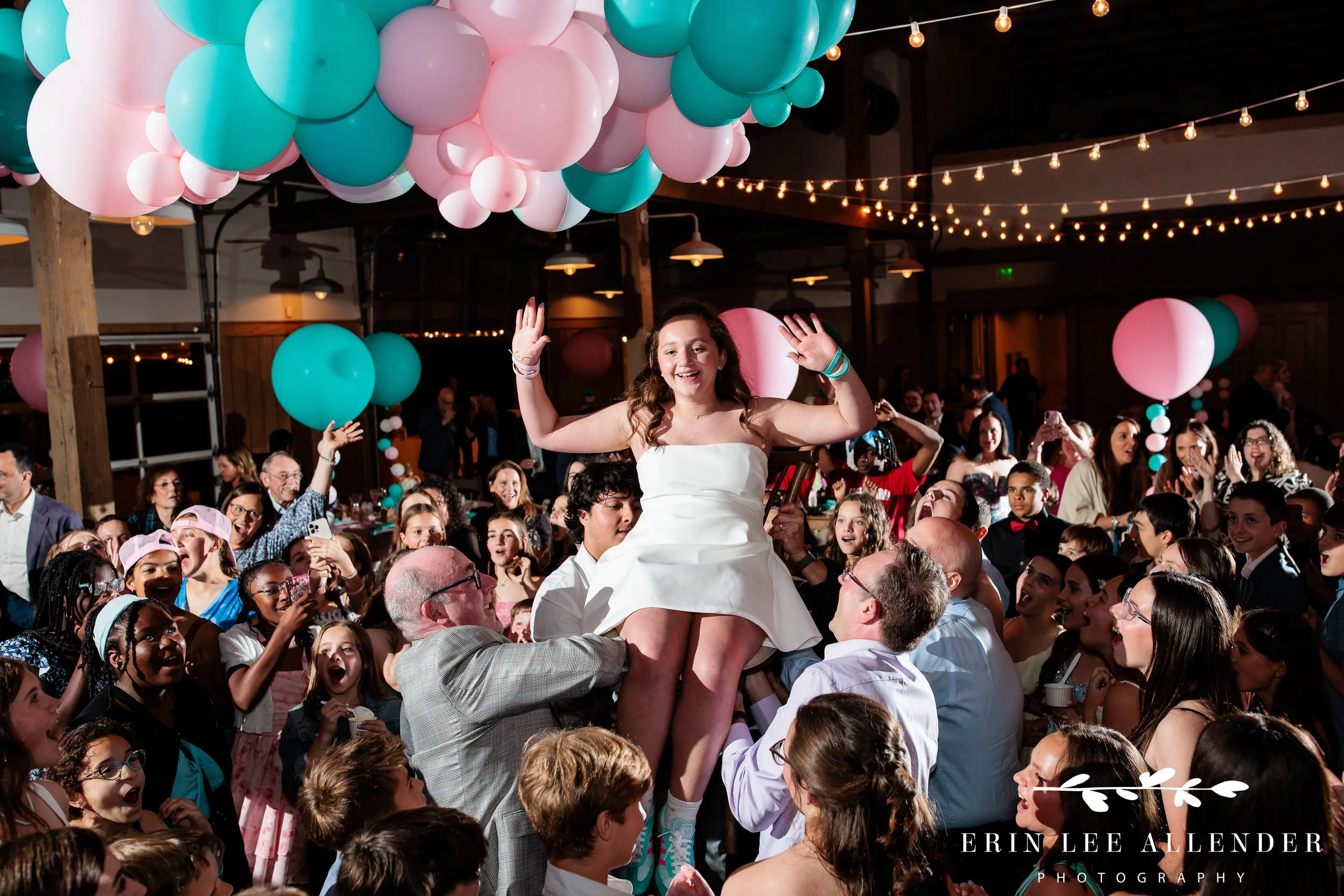 Nashville mitzvah photographer — bat mitzvah lifted in chair during hora at Loveless Barn Nashville