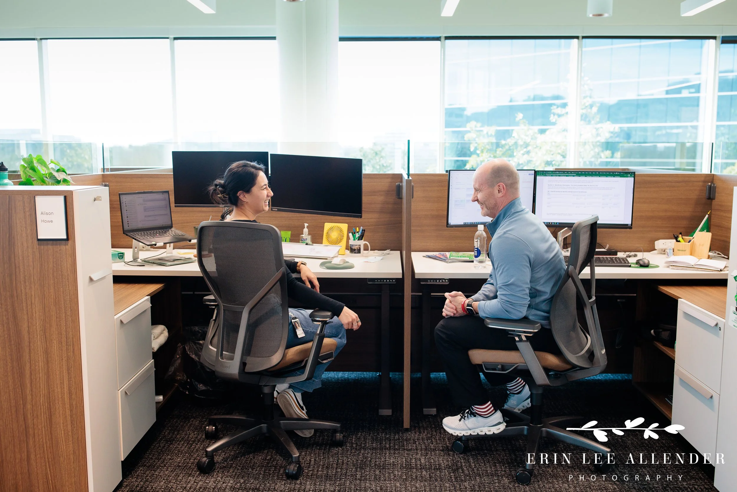 Nashville corporate marketing photography — coworkers connecting across cubicles in TruGreen's Middle Tennessee office