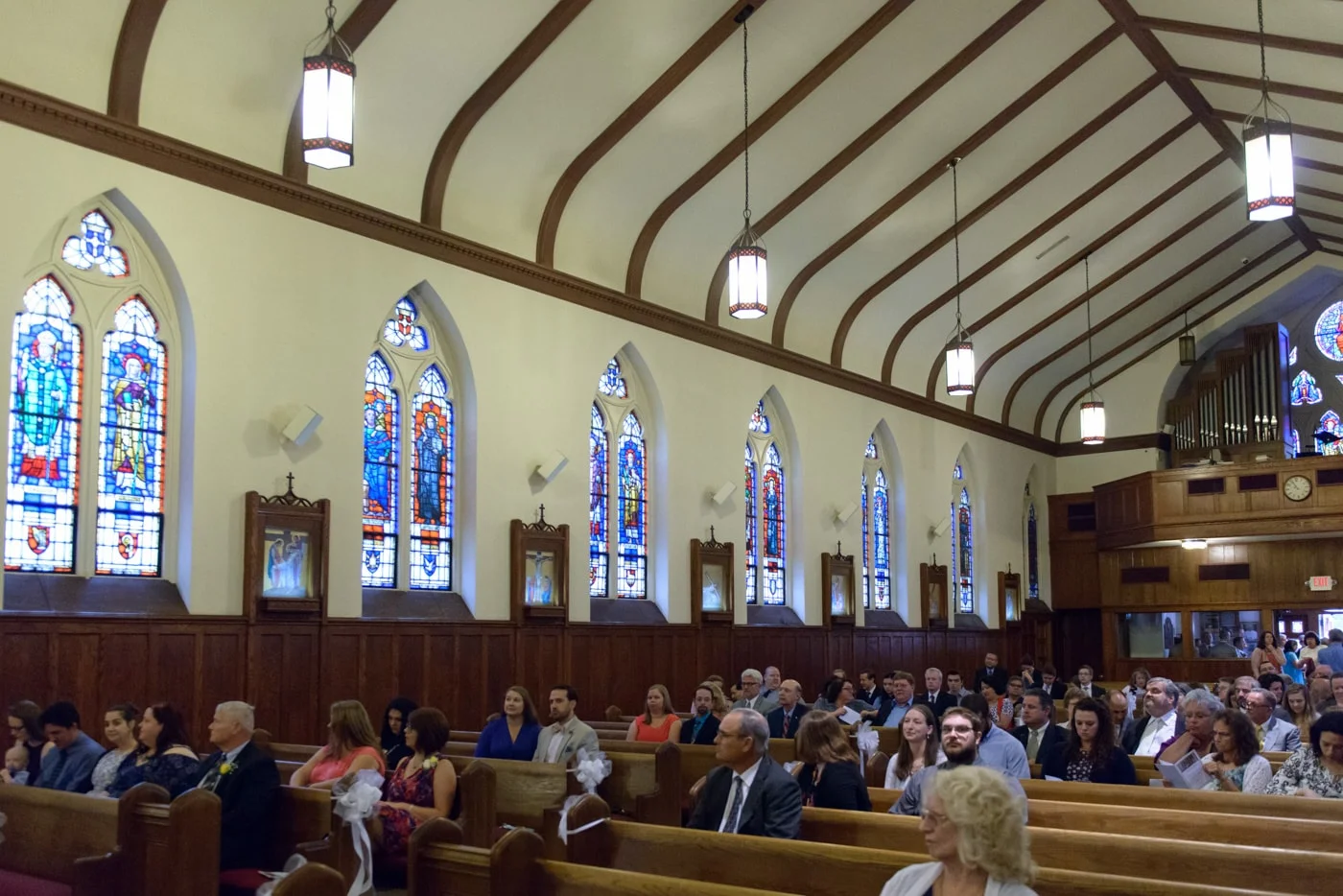 Guests at a wedding at St James Catholic Church in Falls Church, Virginia