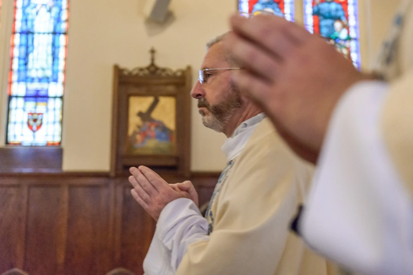 A priest in the wedding procession at St James Catholic Church in Falls Church, Virginia